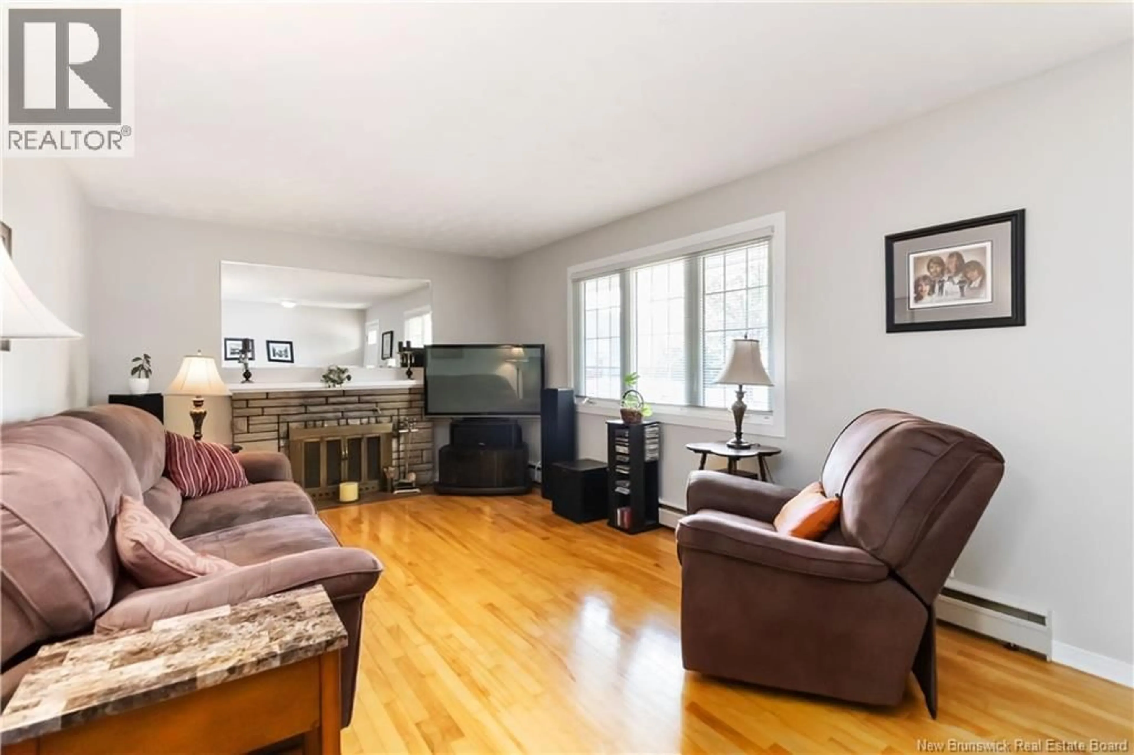 Living room with furniture, wood/laminate floor for 39 LEESIDE DRIVE, Moncton New Brunswick E1C4L4