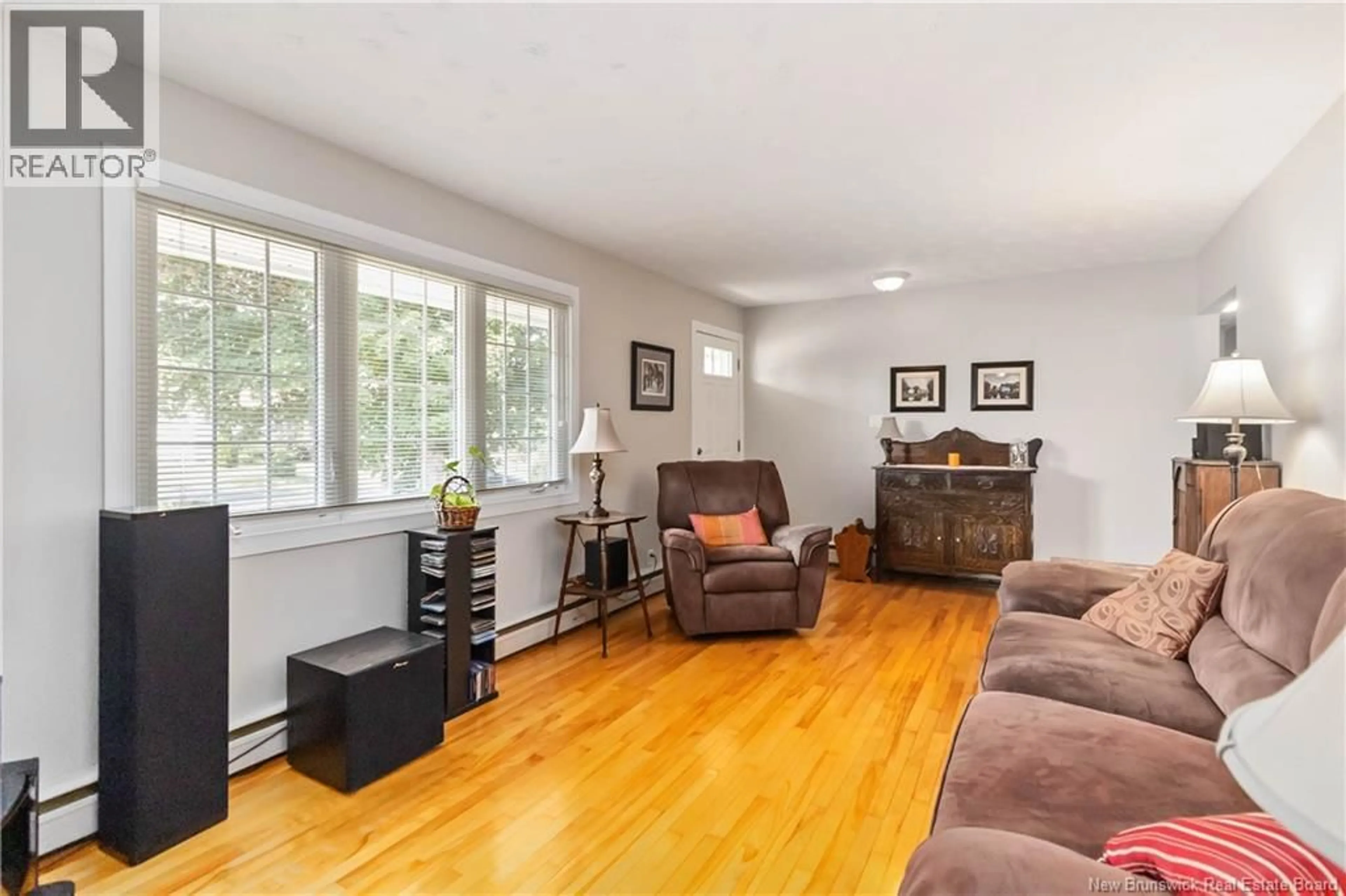 Living room with furniture, wood/laminate floor for 39 LEESIDE DRIVE, Moncton New Brunswick E1C4L4