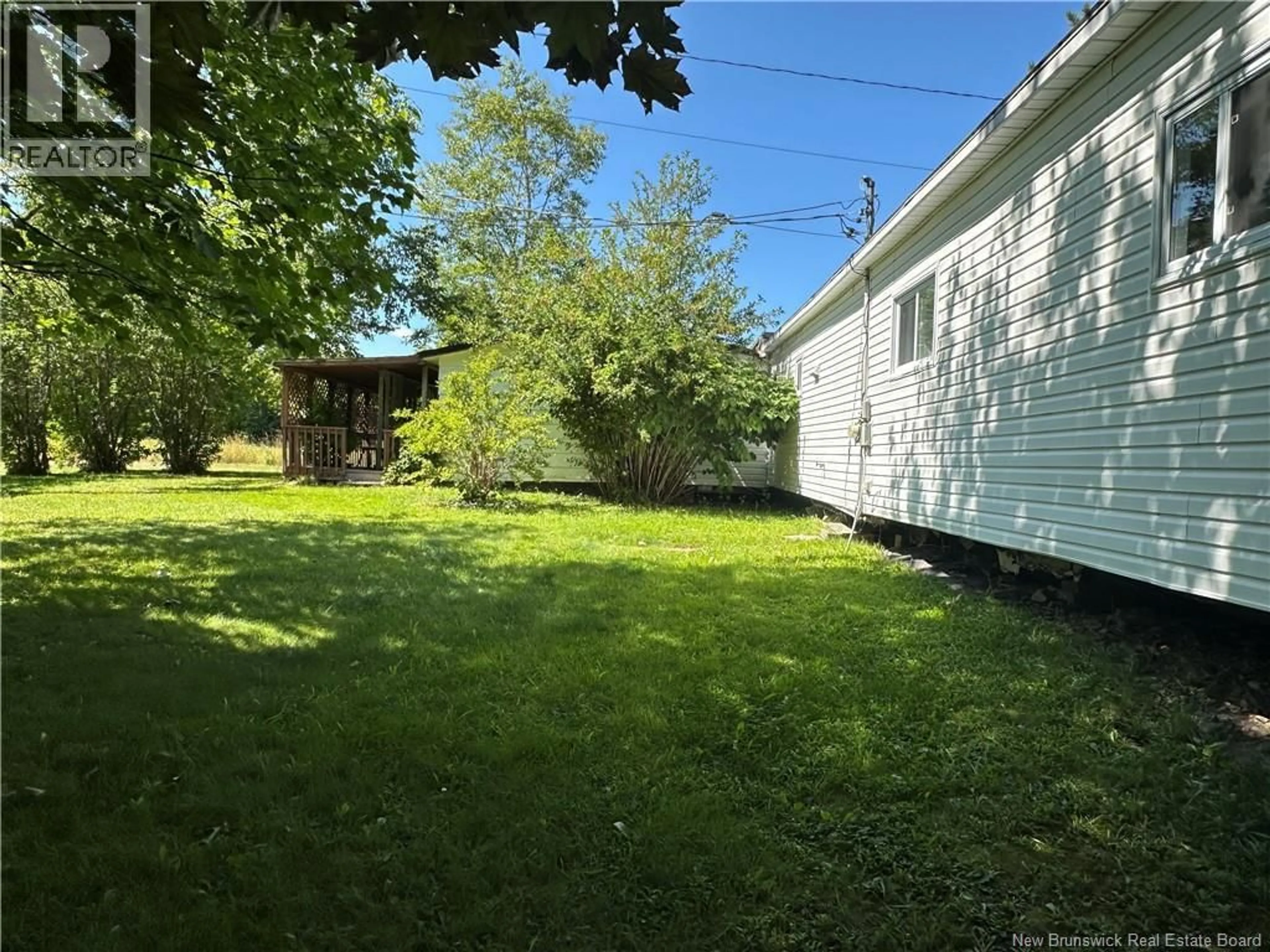 A pic from outside/outdoor area/front of a property/back of a property/a pic from drone, unknown for 1 DOUCET LANE, Nash Creek New Brunswick E8G1Y1