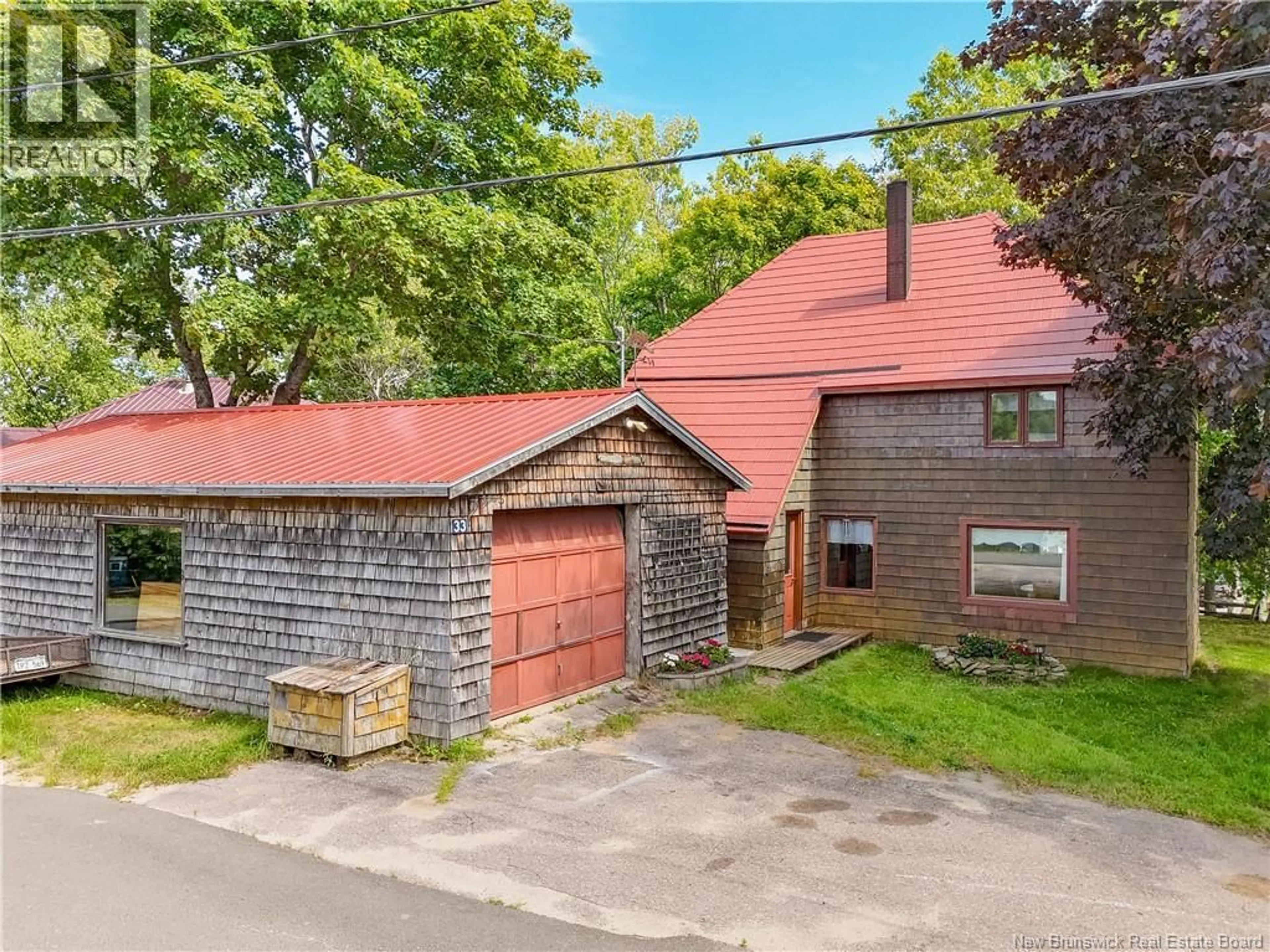 A pic from outside/outdoor area/front of a property/back of a property/a pic from drone, street for 33 ROCKLAND DRIVE, McAdam New Brunswick E6J1V3