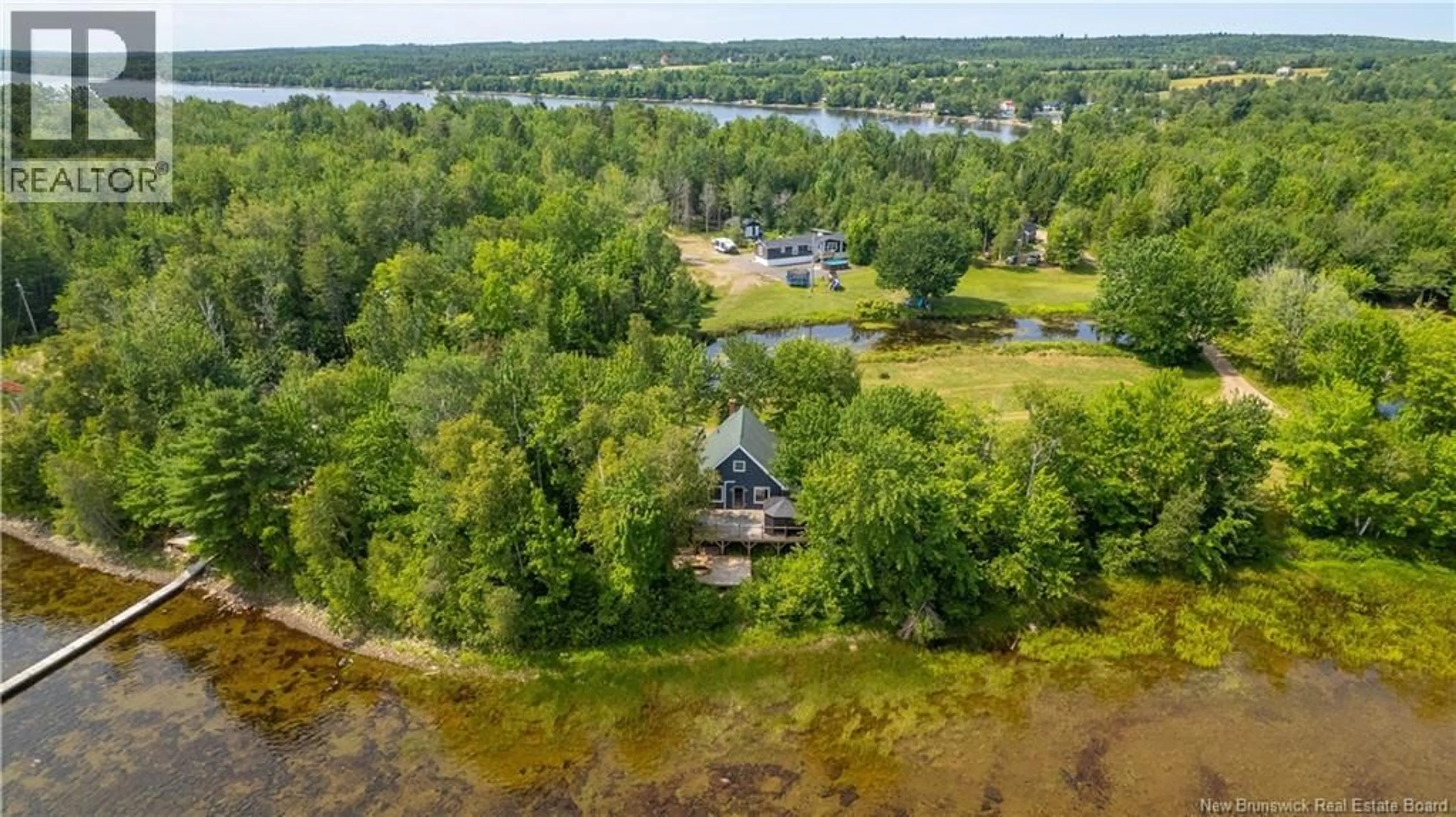 A pic from outside/outdoor area/front of a property/back of a property/a pic from drone, water/lake/river/ocean view for 27 BINK CRESCENT, Harvey New Brunswick E6K1J3