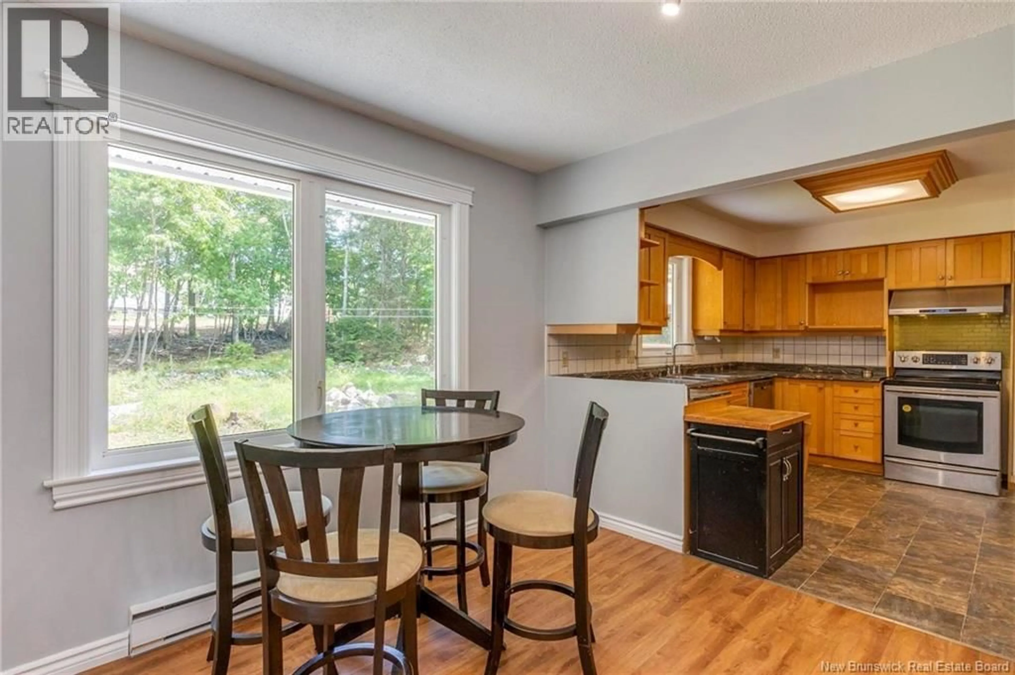 Open concept kitchen, wood/laminate floor for 4 LORI COURT, Rothesay New Brunswick E2E3J5