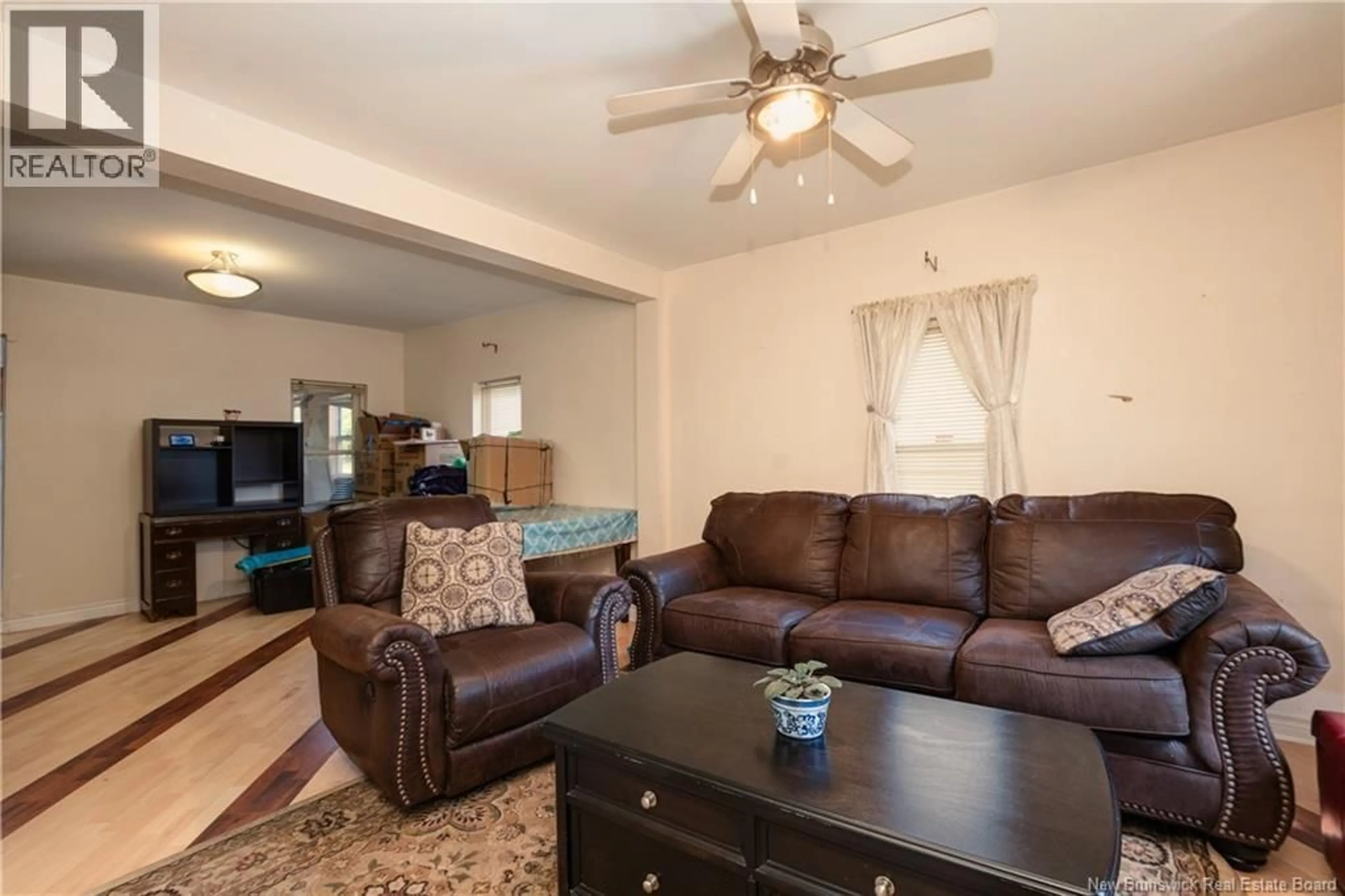 Living room with furniture, wood/laminate floor for 60 ELM STREET, Moncton New Brunswick E1C5T6