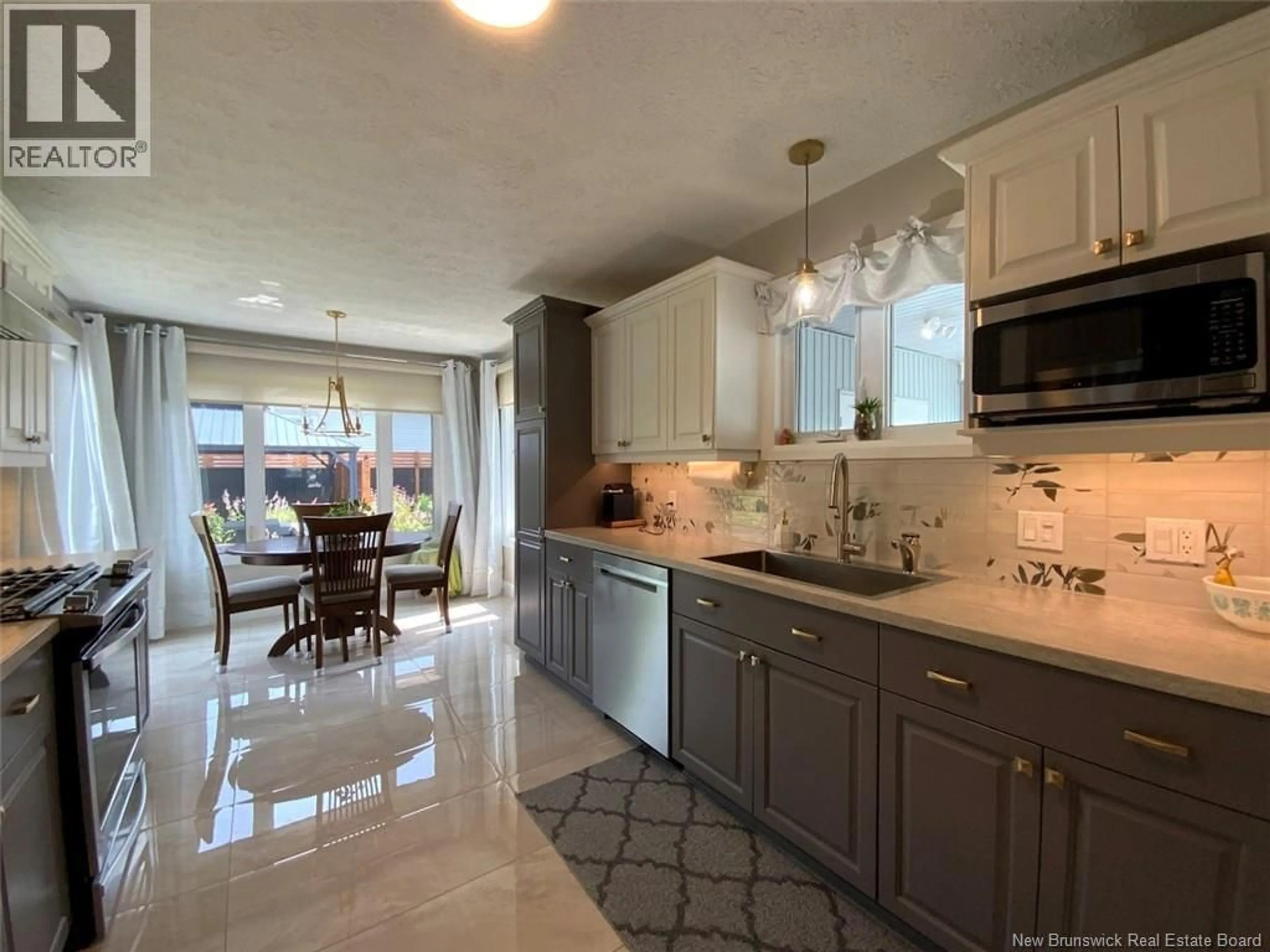 Open concept kitchen, ceramic/tile floor for 23 GAUDREAU AVENUE, Edmundston New Brunswick E3V4B9