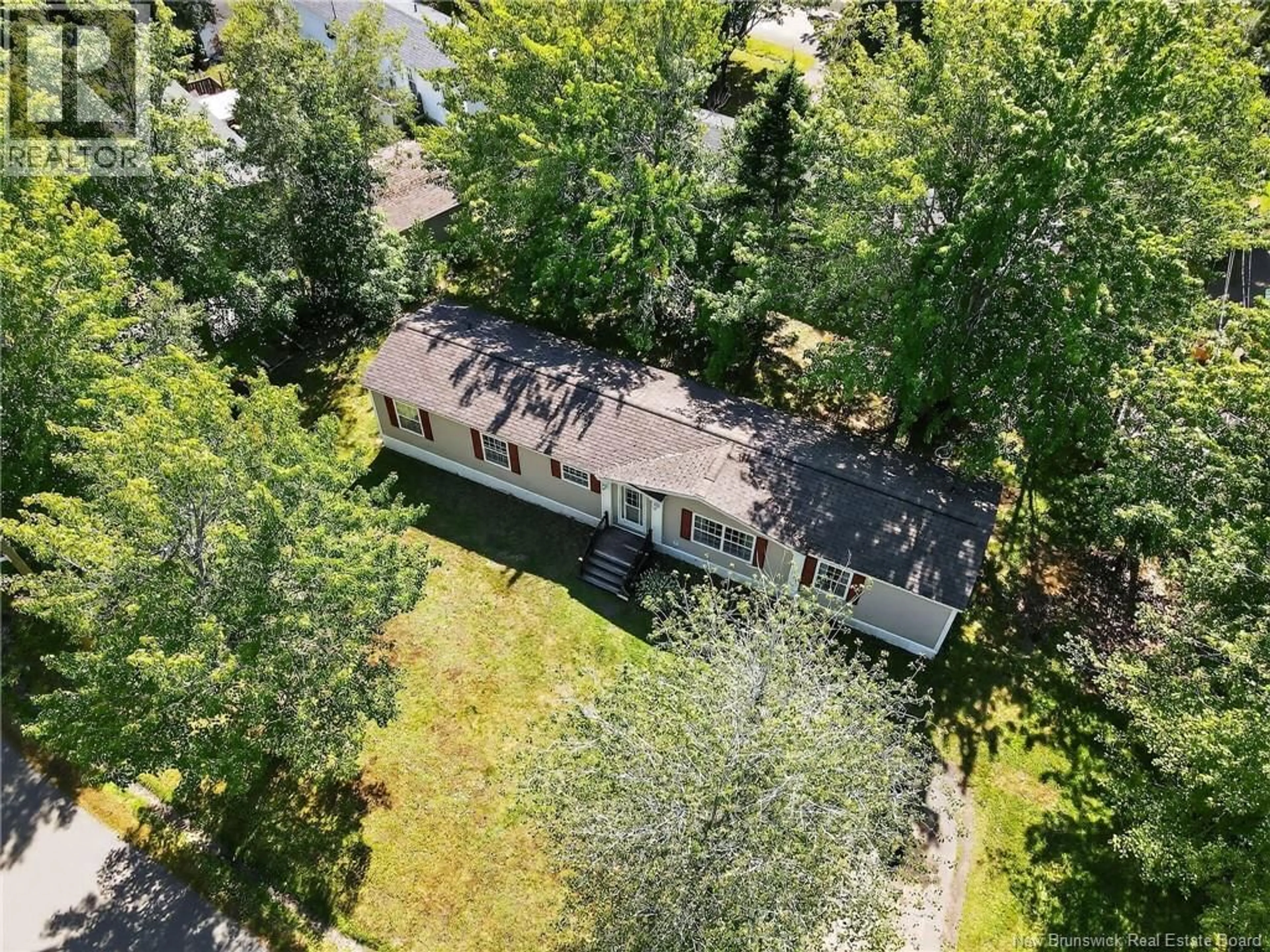 A pic from outside/outdoor area/front of a property/back of a property/a pic from drone, forest/trees view for 7 CEDARGROVE, Moncton New Brunswick E1H2T8