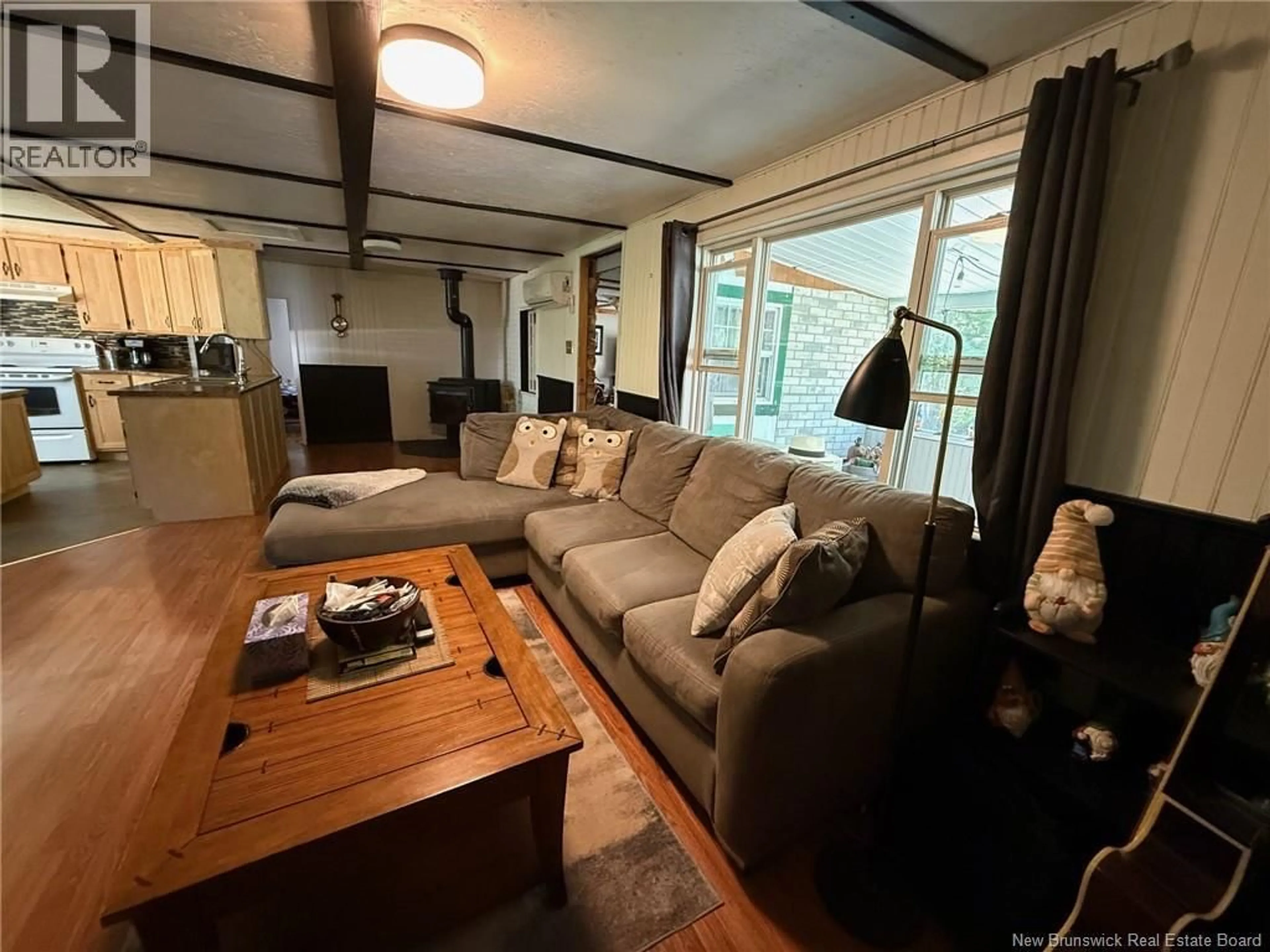Living room with furniture, wood/laminate floor for 818 CAPE ROAD, Newburg New Brunswick E7N1W6