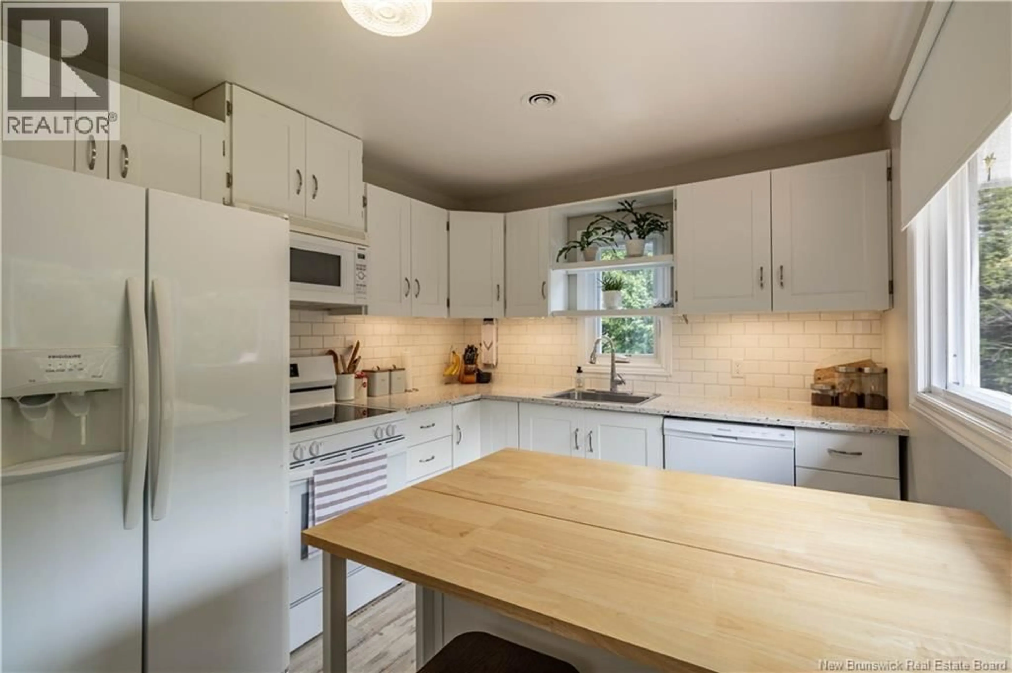 Open concept kitchen, wood/laminate floor for 20 FRASER BROOK ROAD, Nauwigewauk New Brunswick E5N6W3