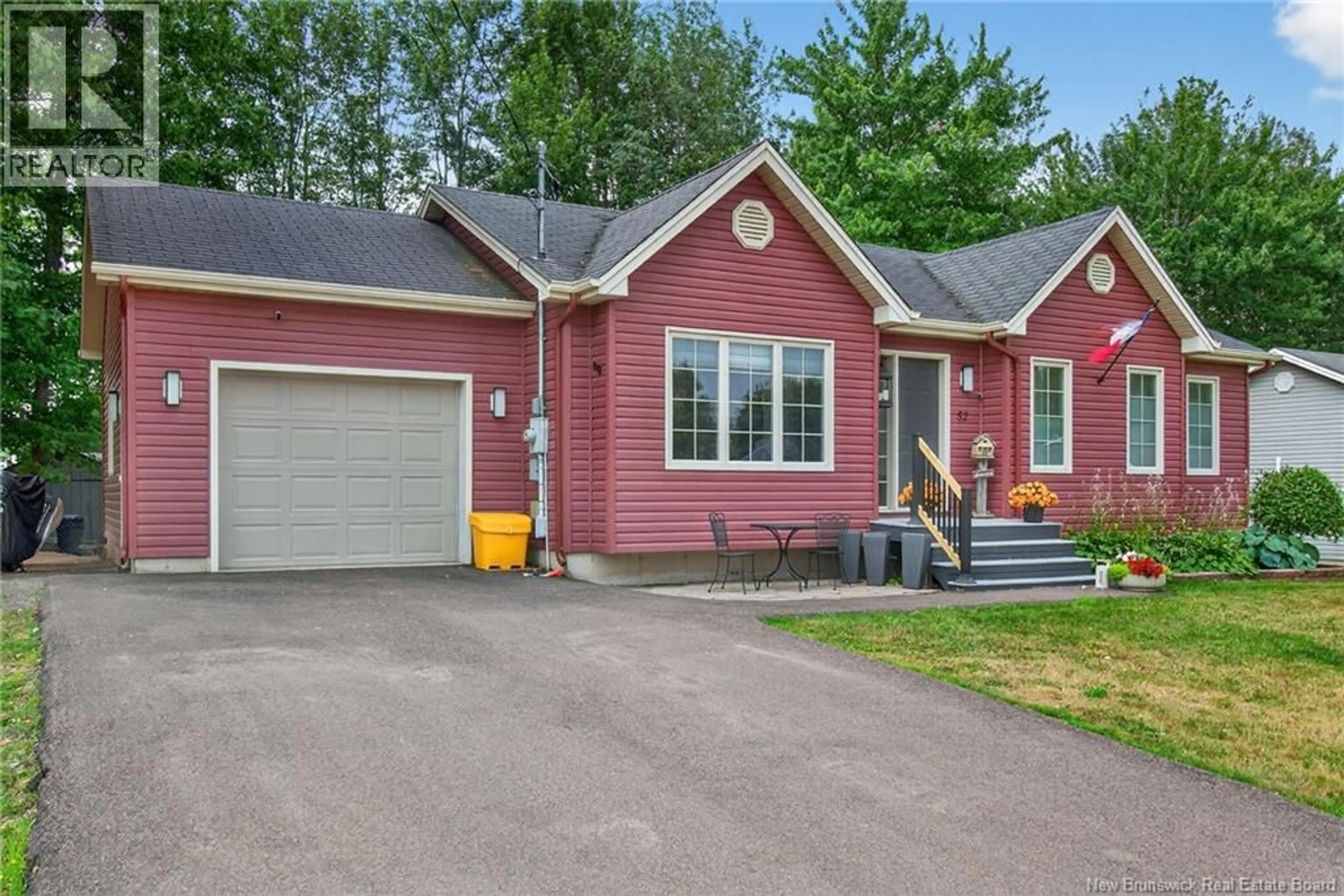 Home with vinyl exterior material, street for 52 HERMAN, Dieppe New Brunswick E1A0L5