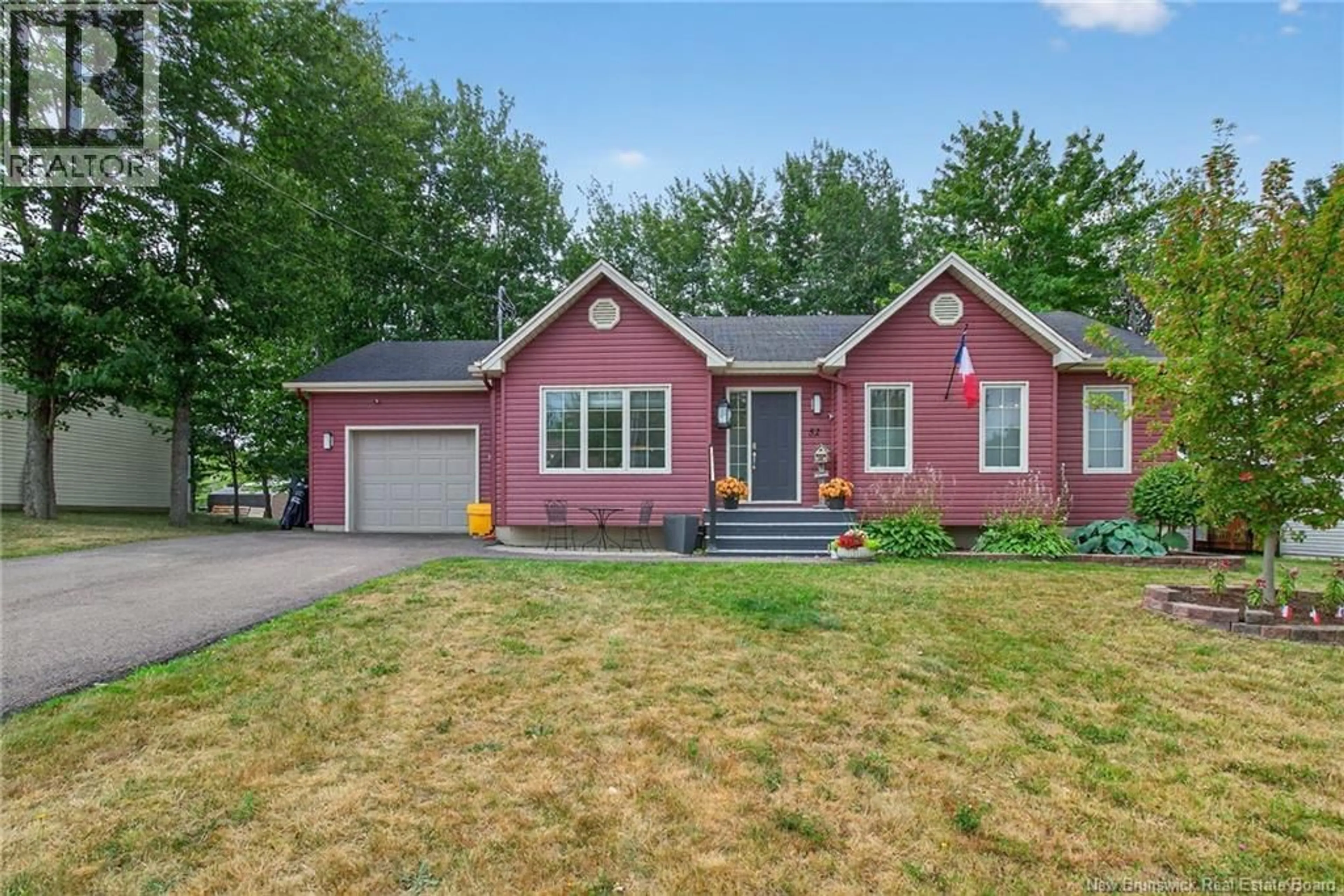 Home with vinyl exterior material, street for 52 HERMAN, Dieppe New Brunswick E1A0L5