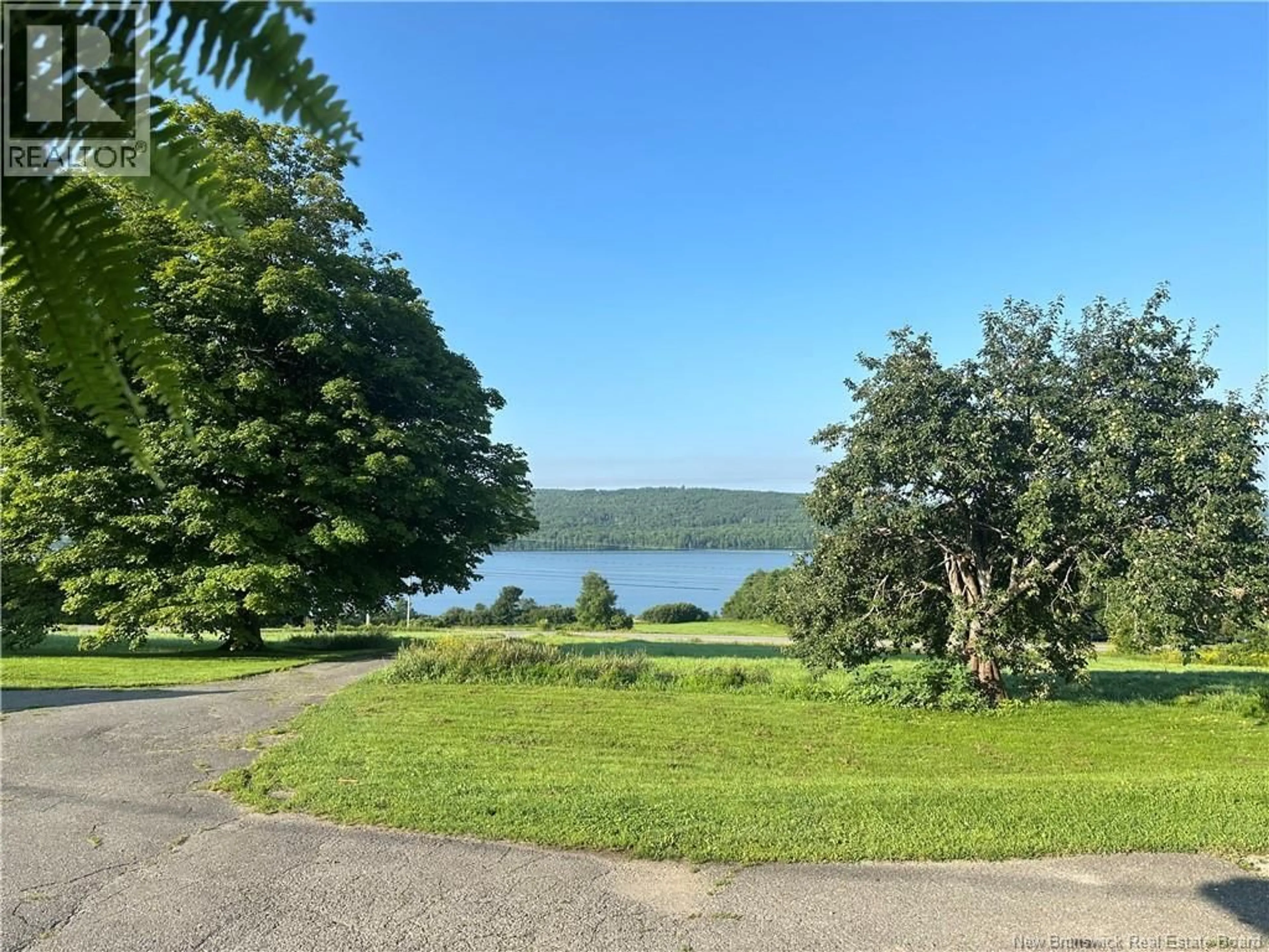 A pic from outside/outdoor area/front of a property/back of a property/a pic from drone, water/lake/river/ocean view for 4790 ROUTE 105, Upper Queensbury New Brunswick E6G1W6