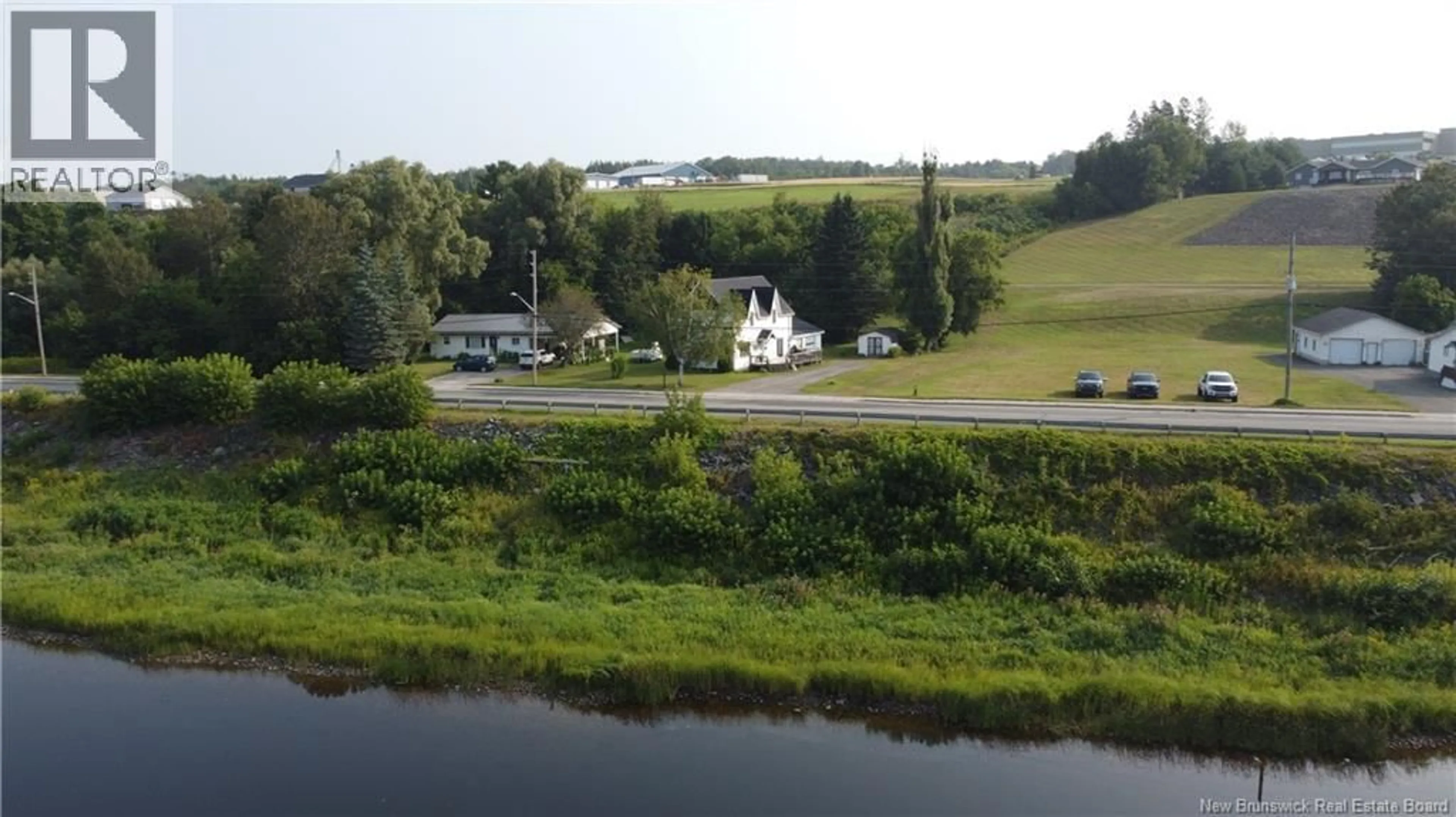 A pic from outside/outdoor area/front of a property/back of a property/a pic from drone, water/lake/river/ocean view for 166 MAIN STREET, Hartland New Brunswick E7P2M5