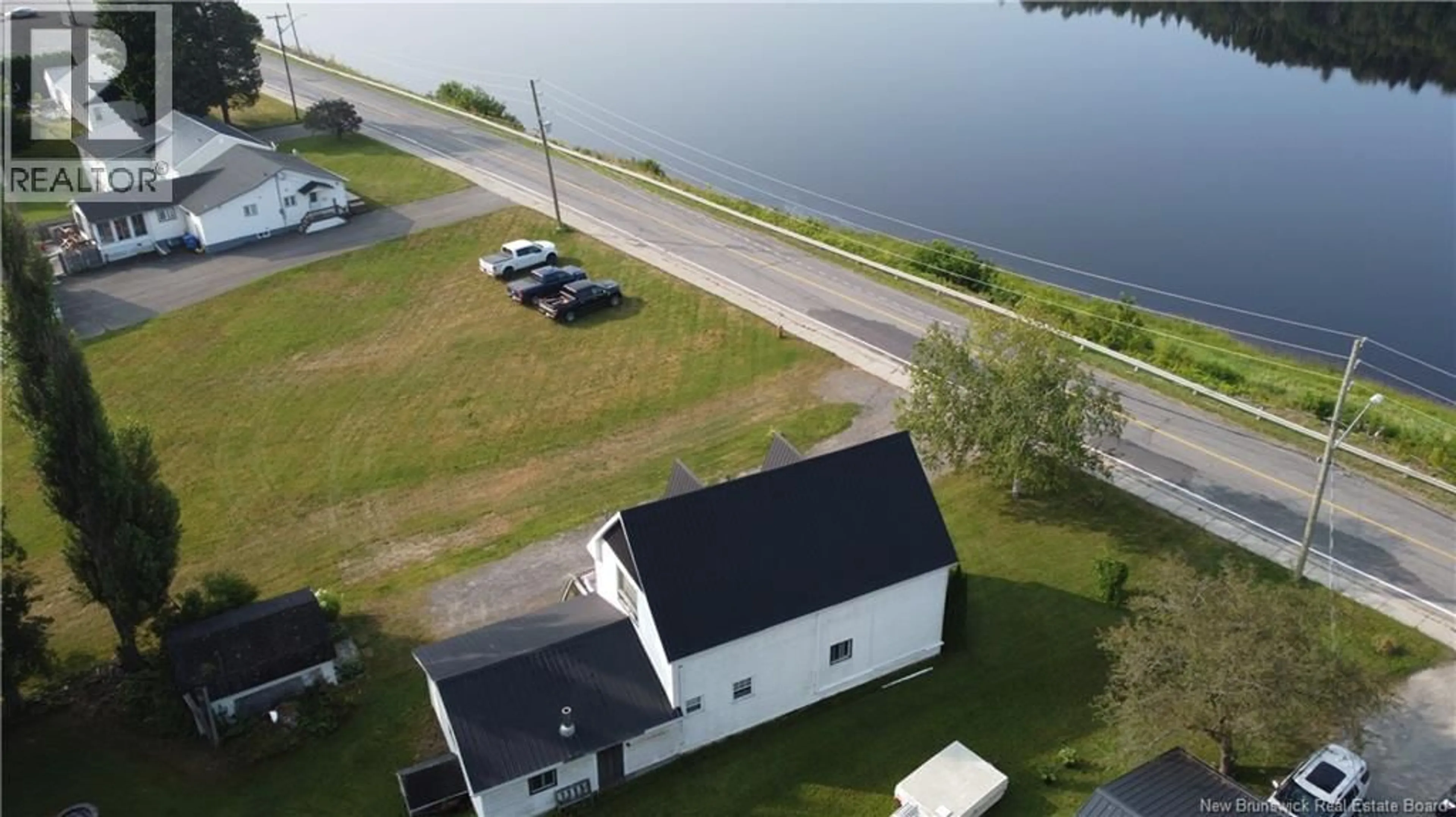 A pic from outside/outdoor area/front of a property/back of a property/a pic from drone, water/lake/river/ocean view for 166 MAIN STREET, Hartland New Brunswick E7P2M5