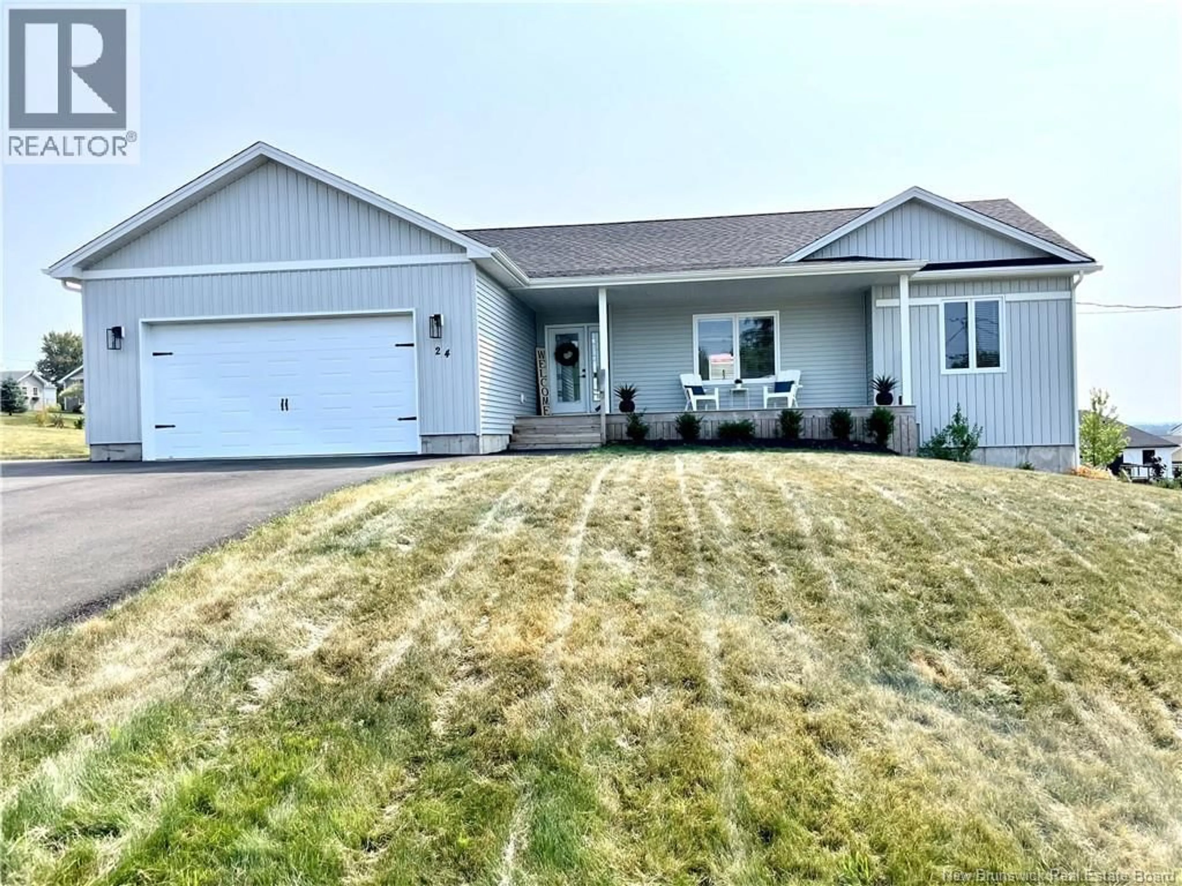 Home with vinyl exterior material, street for 24 FLAGSTONE DRIVE, Quispamsis New Brunswick E2G0B6