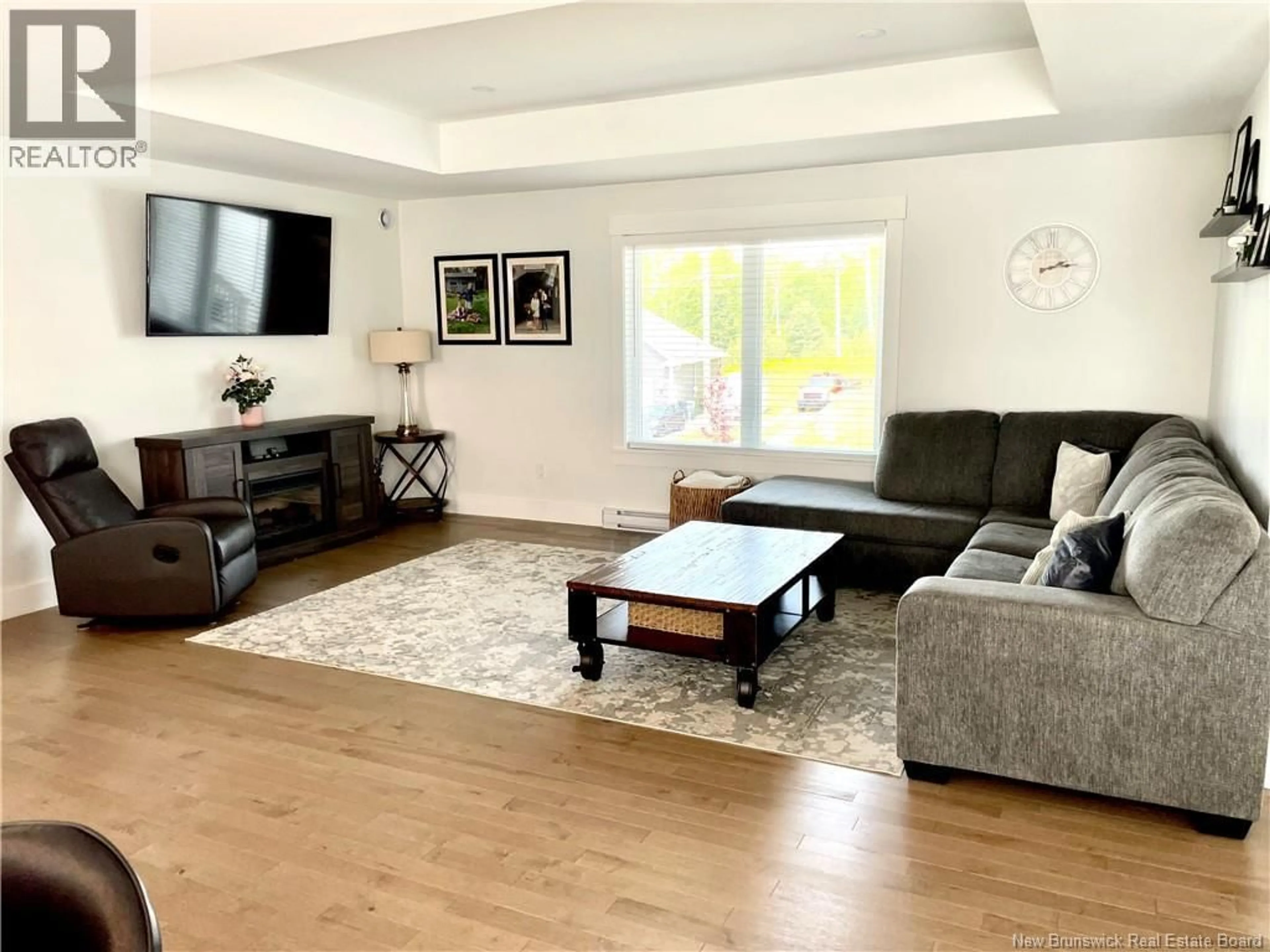 Living room with furniture, wood/laminate floor for 24 FLAGSTONE DRIVE, Quispamsis New Brunswick E2G0B6
