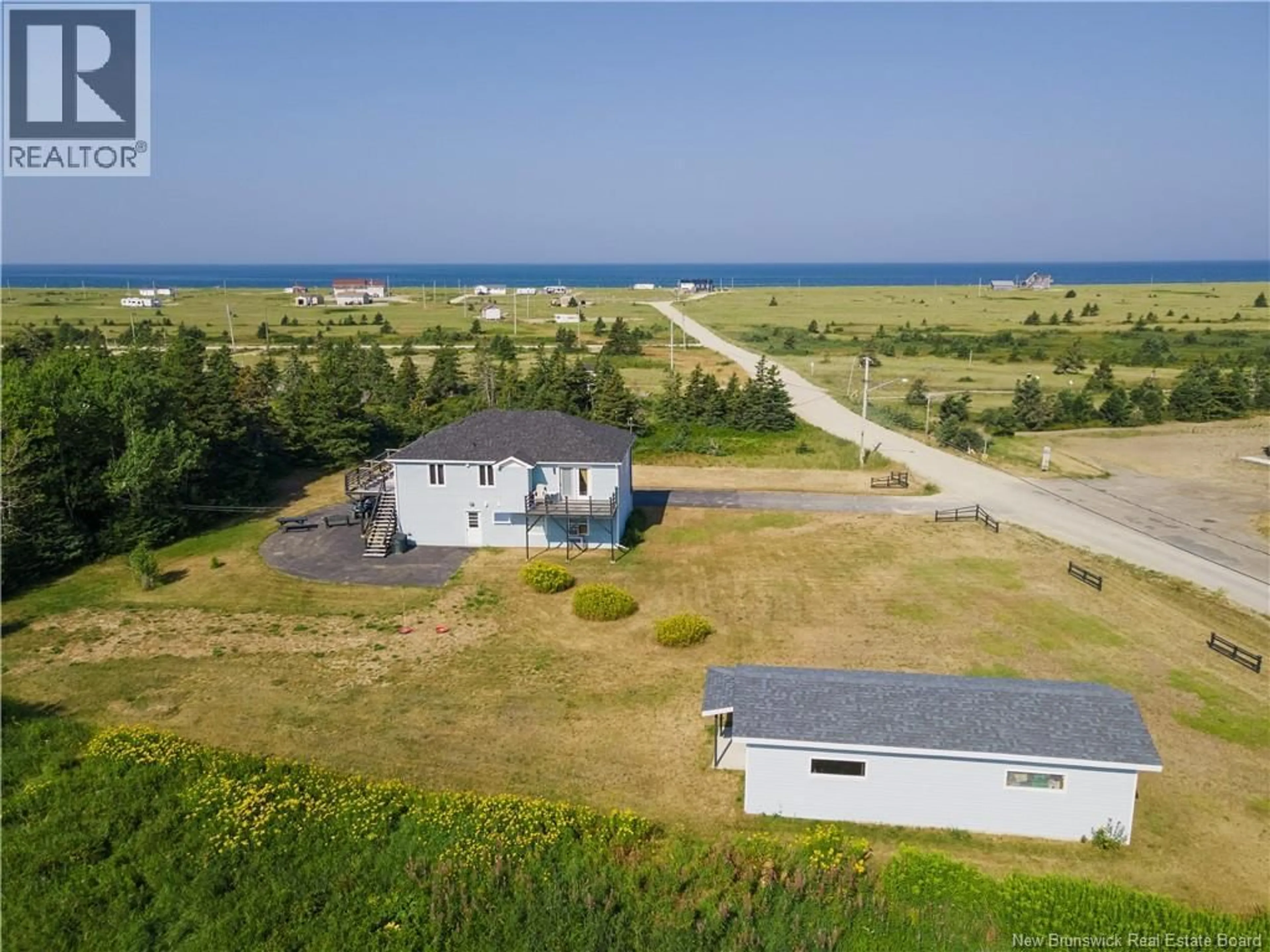 A pic from outside/outdoor area/front of a property/back of a property/a pic from drone, water/lake/river/ocean view for 181 WARD ROAD, Miscou New Brunswick E8T2G5