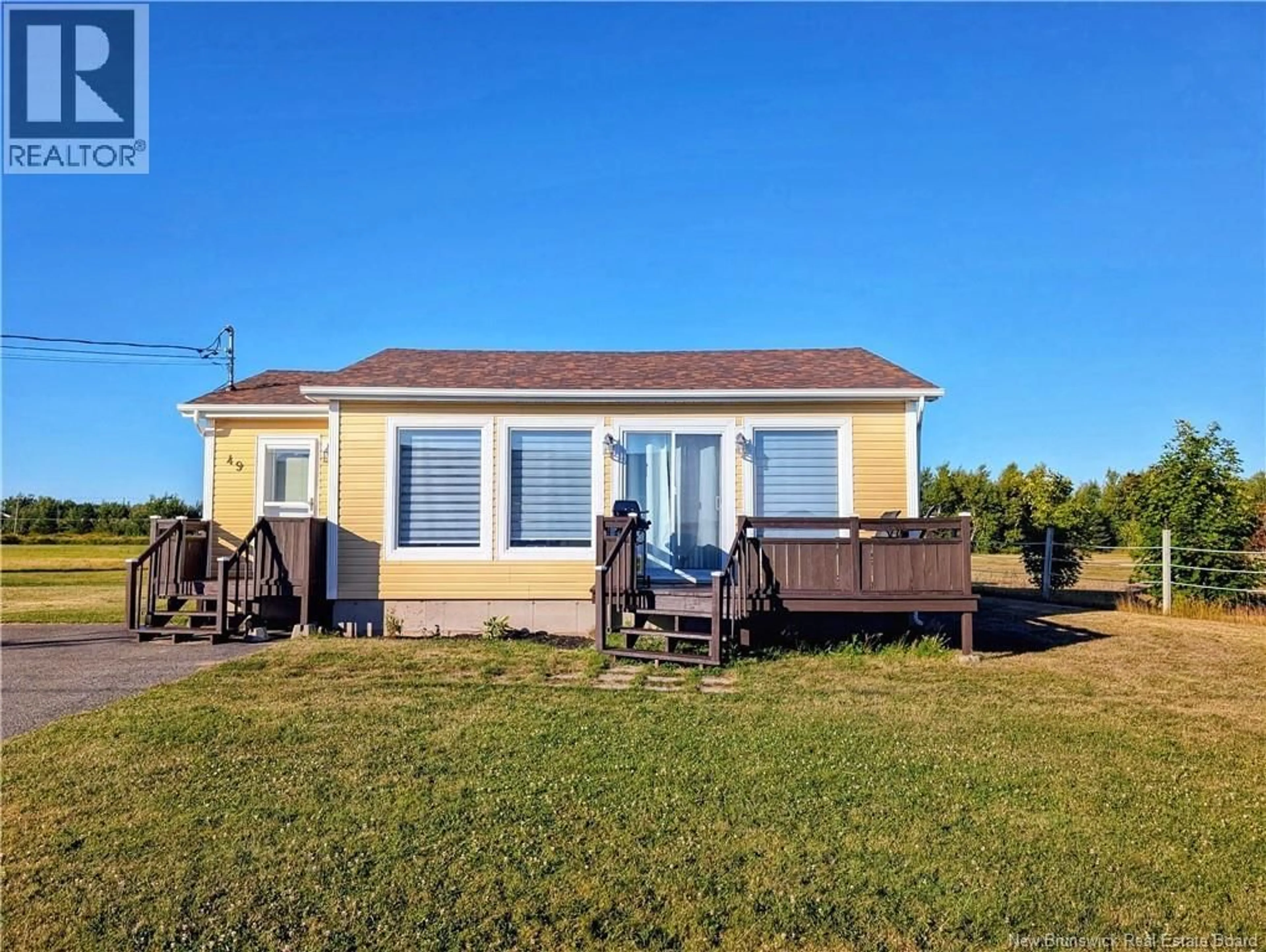 A pic from outside/outdoor area/front of a property/back of a property/a pic from drone, unknown for 49 RUE DES CHALETS, Inkerman Ferry New Brunswick E8P1V8