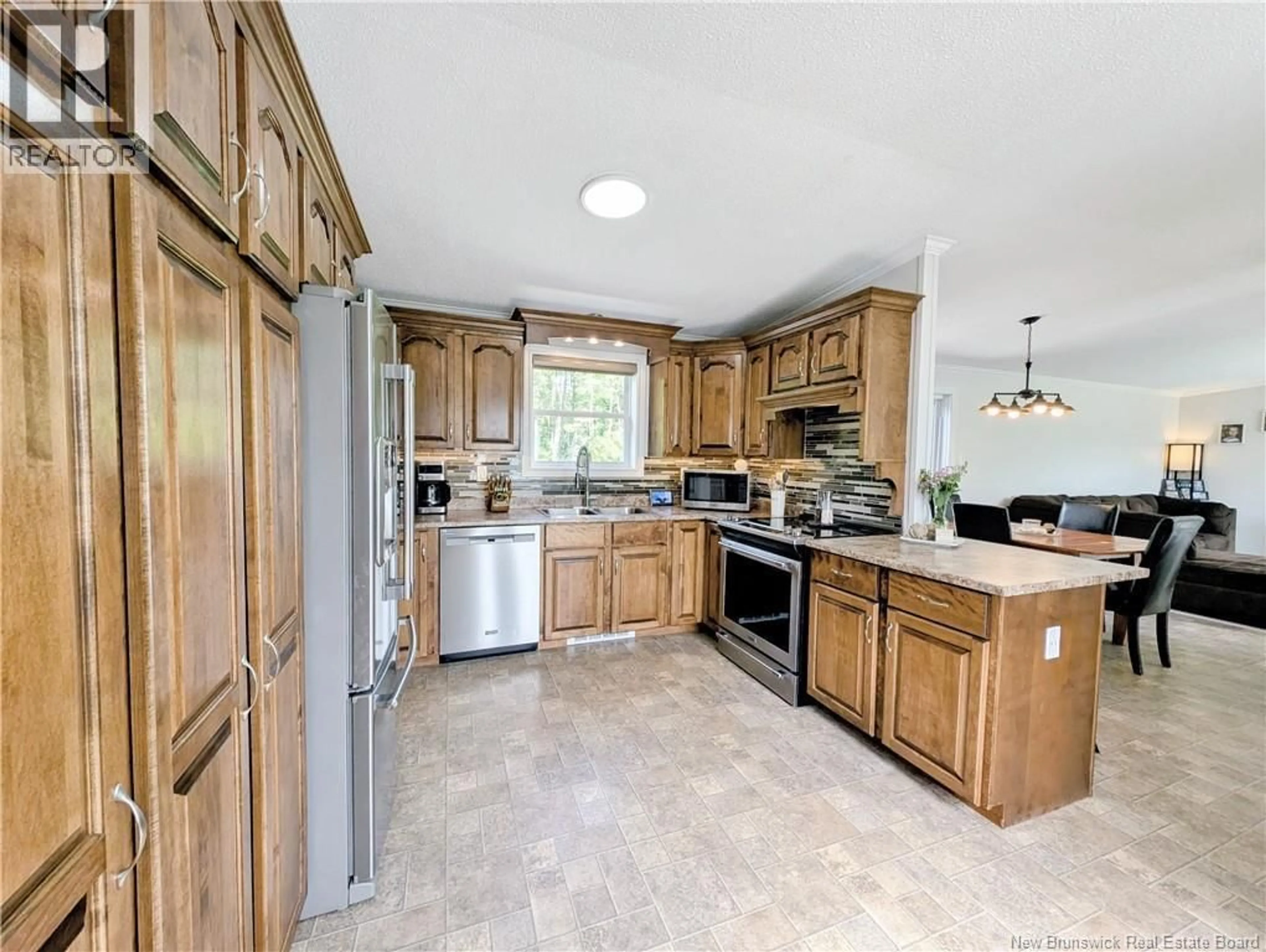 Open concept kitchen, ceramic/tile floor for 2455 NB 160, Saint-Sauveur New Brunswick E8L1P6