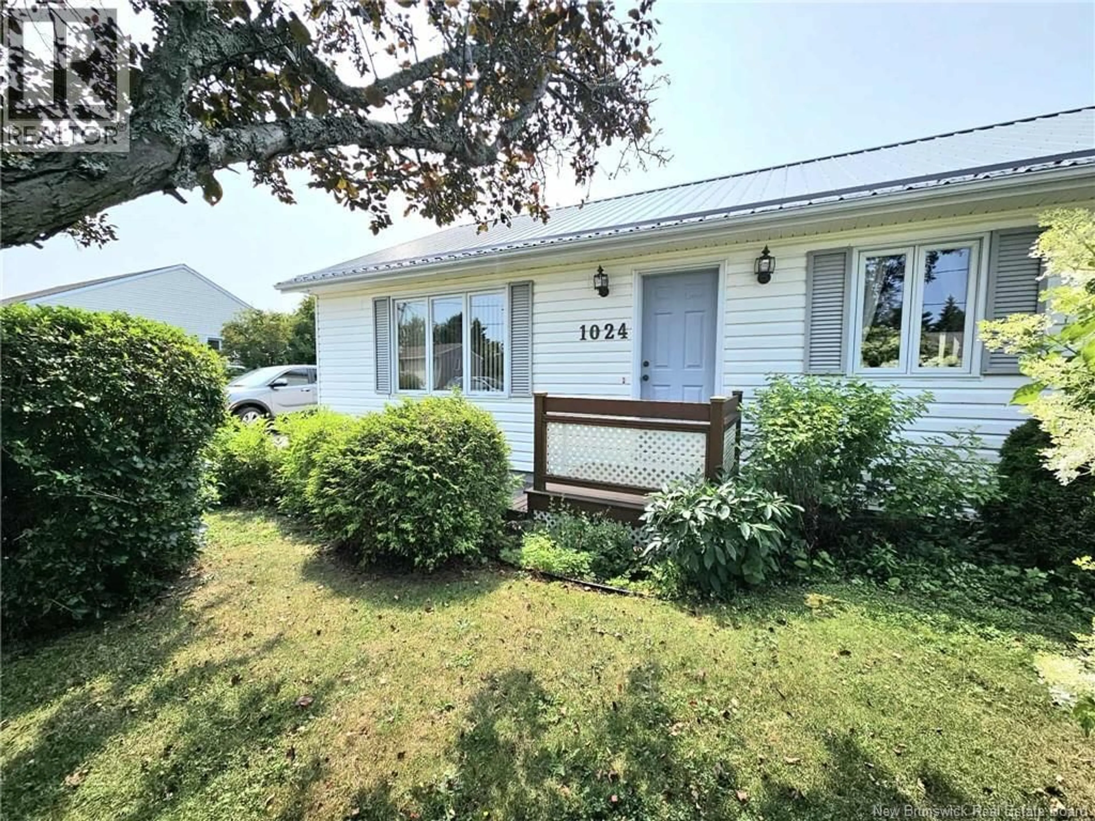 Home with vinyl exterior material, street for 1024 RUE HACHE RUE, Beresford New Brunswick E8K1H8