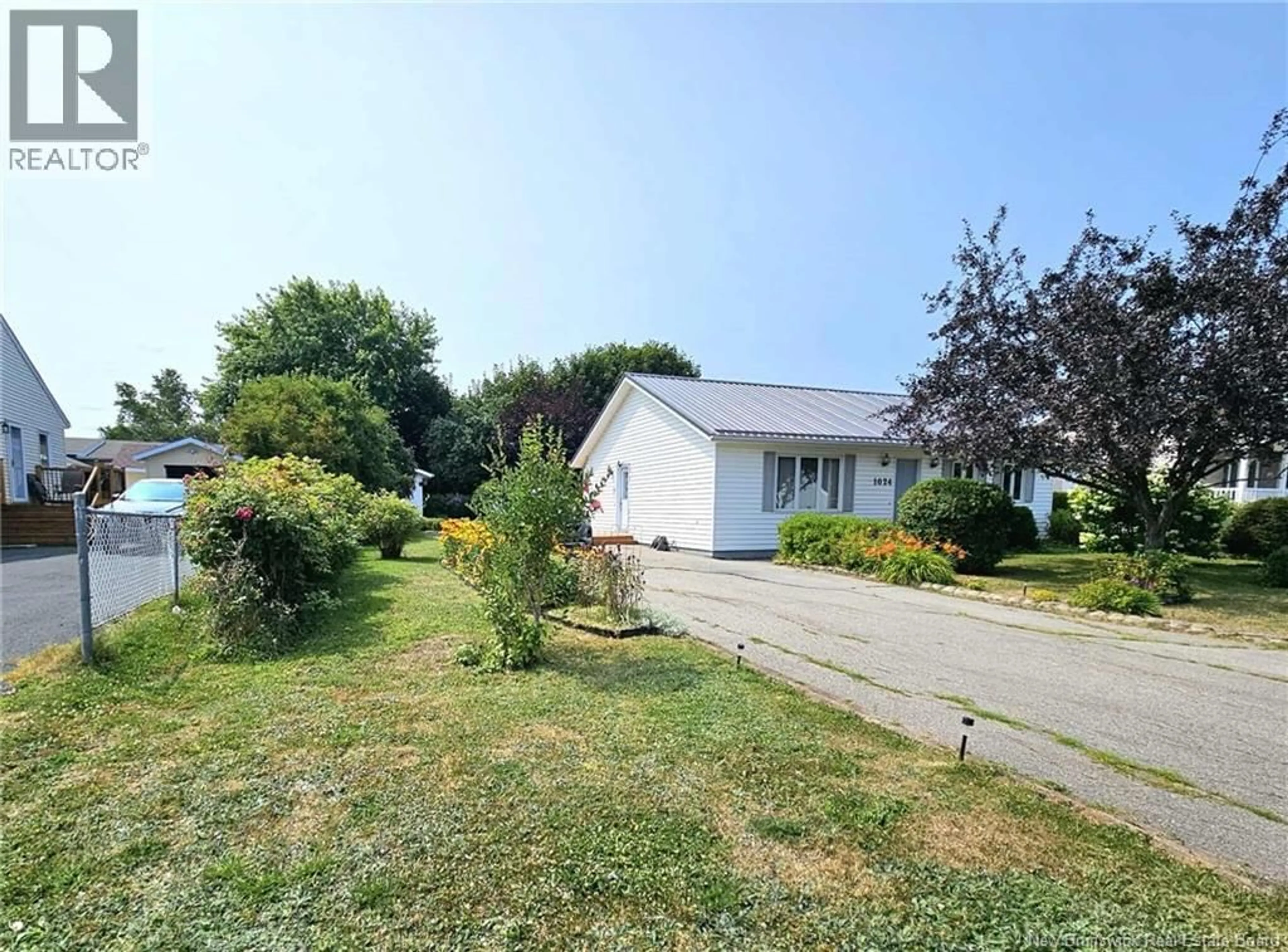 A pic from outside/outdoor area/front of a property/back of a property/a pic from drone, street for 1024 RUE HACHE RUE, Beresford New Brunswick E8K1H8