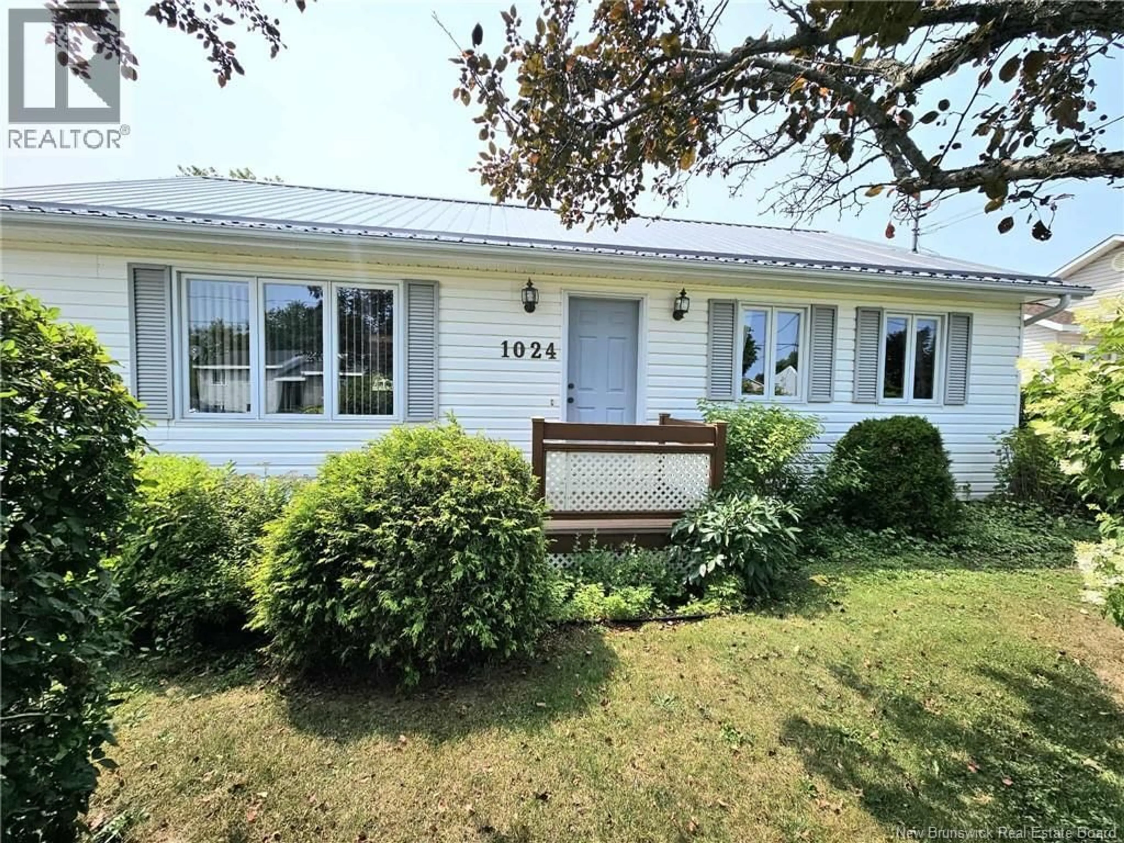 Home with vinyl exterior material, street for 1024 RUE HACHE RUE, Beresford New Brunswick E8K1H8