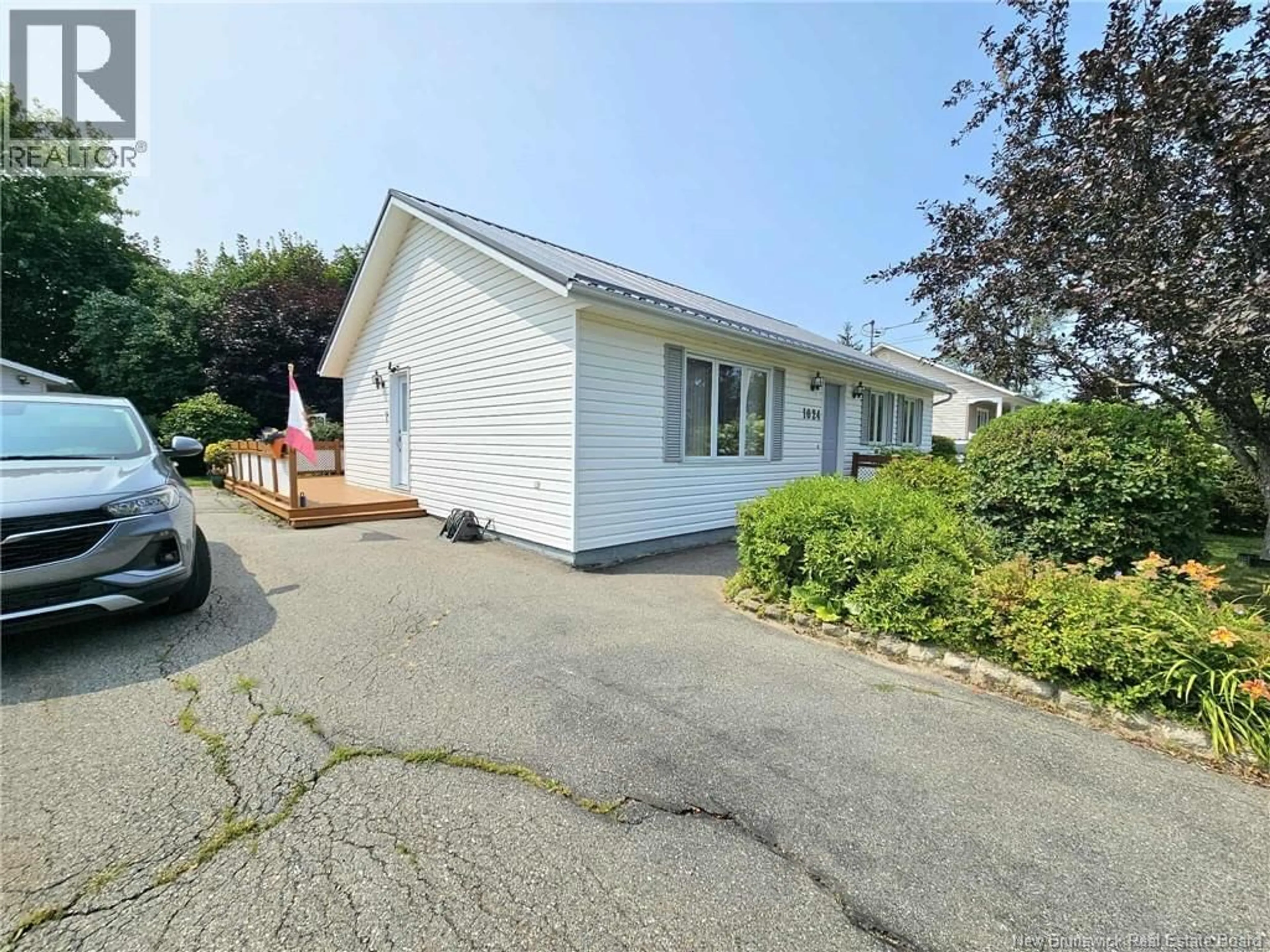 A pic from outside/outdoor area/front of a property/back of a property/a pic from drone, street for 1024 RUE HACHE RUE, Beresford New Brunswick E8K1H8