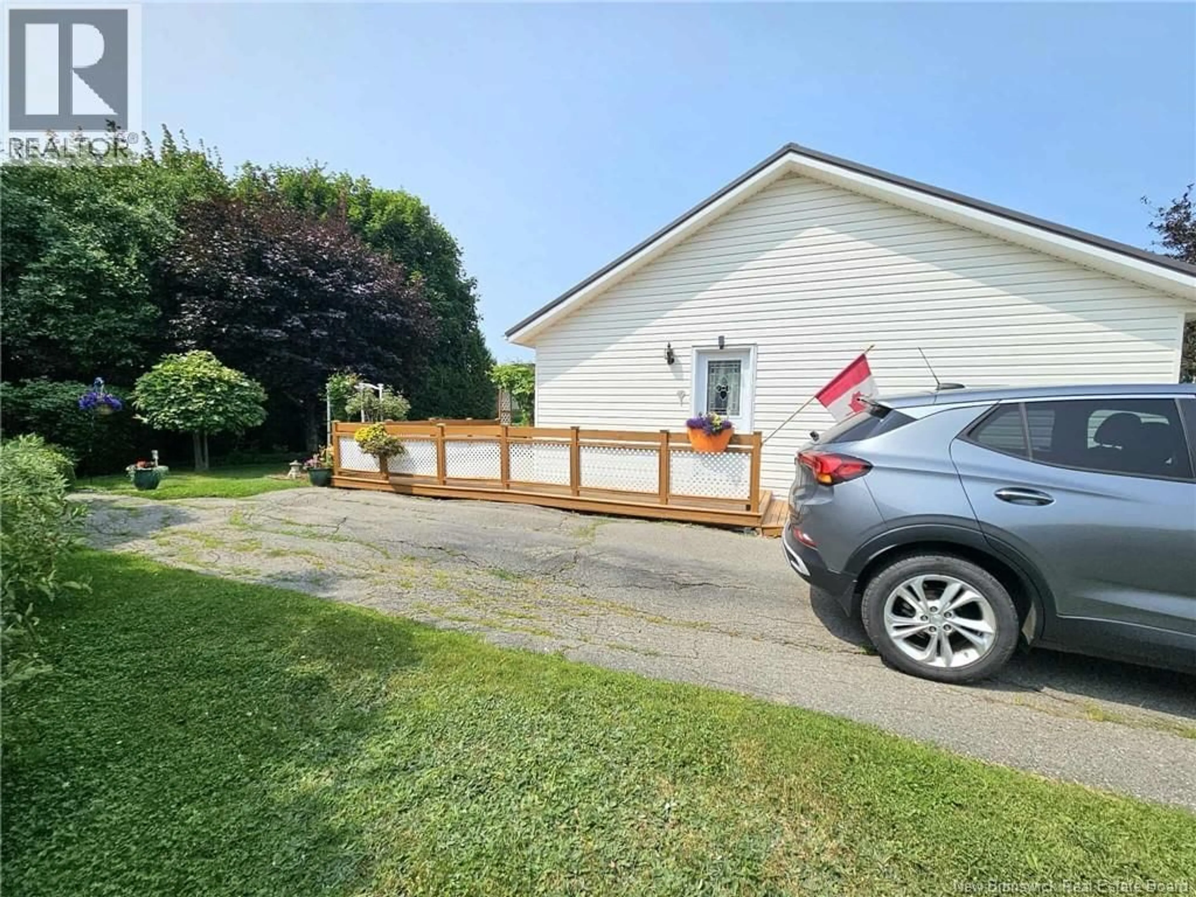 A pic from outside/outdoor area/front of a property/back of a property/a pic from drone, street for 1024 RUE HACHE RUE, Beresford New Brunswick E8K1H8