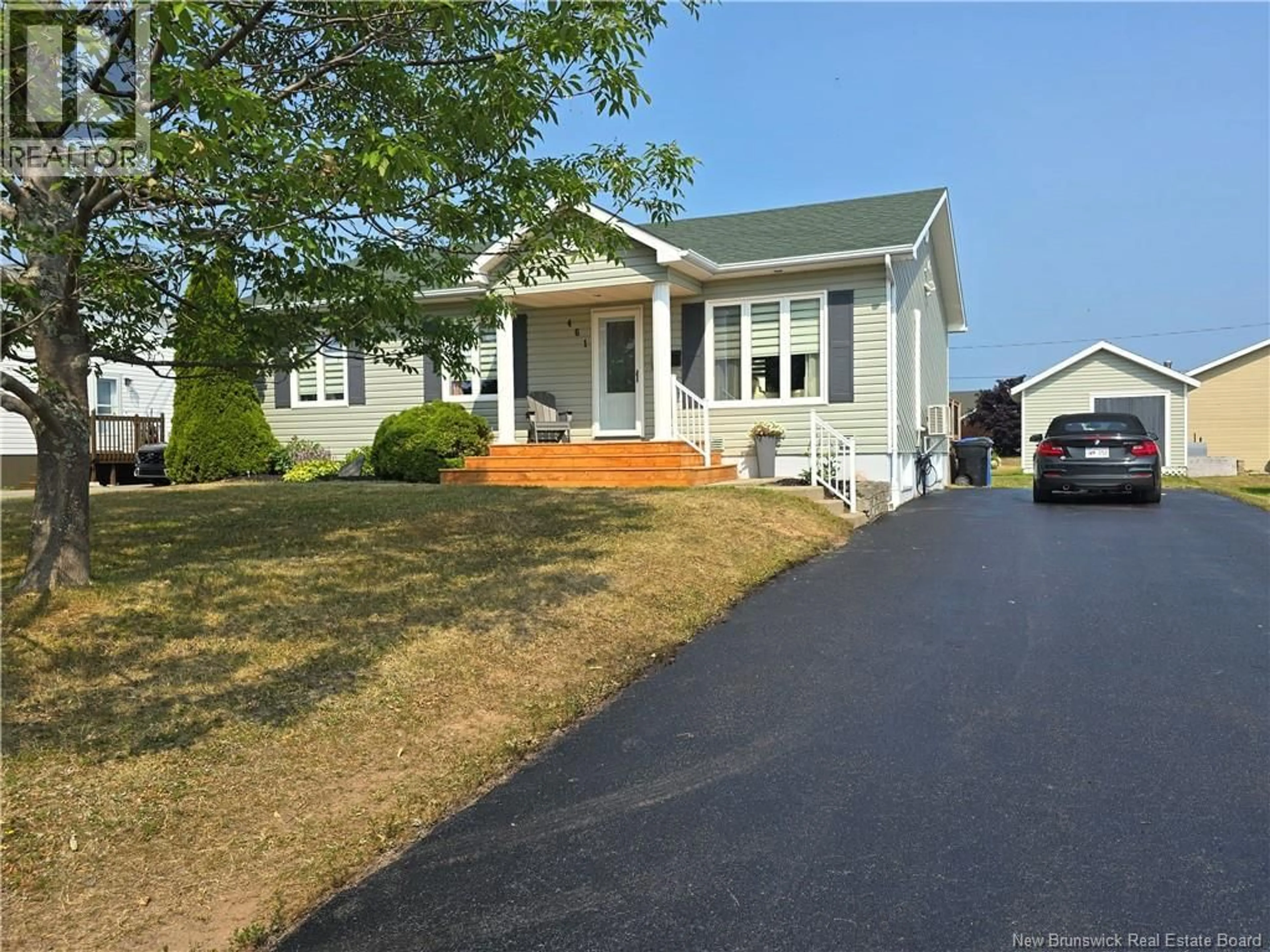 Home with vinyl exterior material, street for 461 MSGR RICHARD STREET, Beresford New Brunswick E8K1Z1