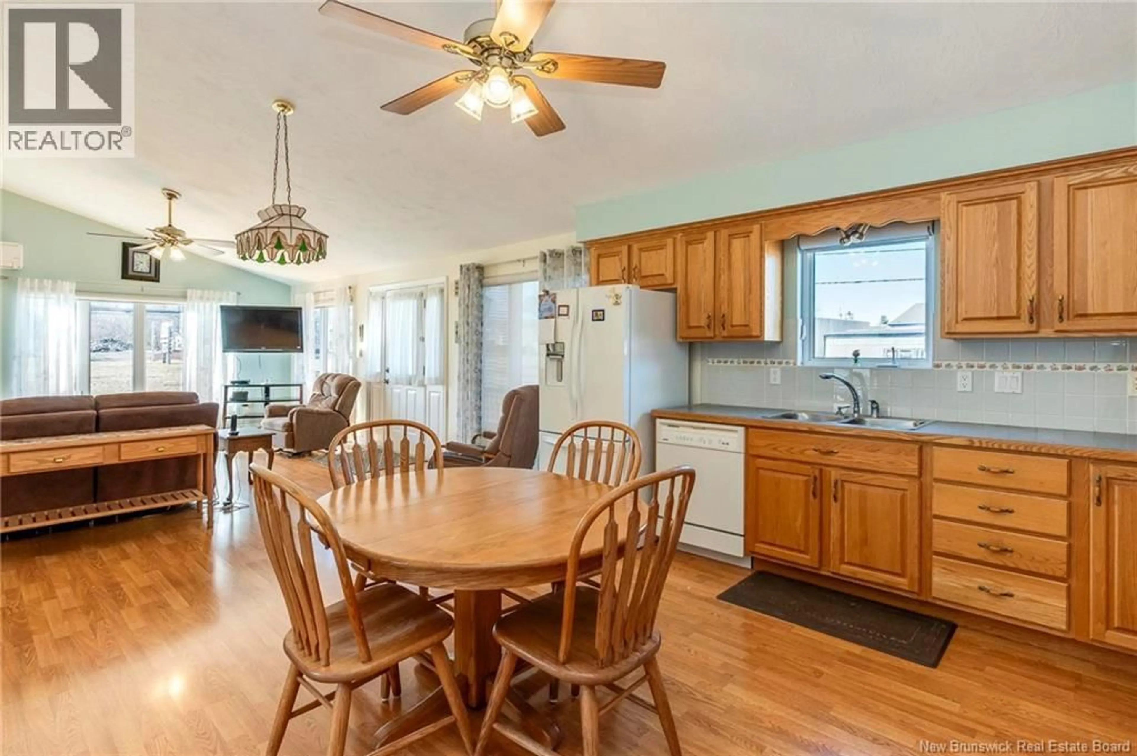 Open concept kitchen, wood/laminate floor for 14 POINTE DU CHENE ROAD, Shediac New Brunswick E4P2M2