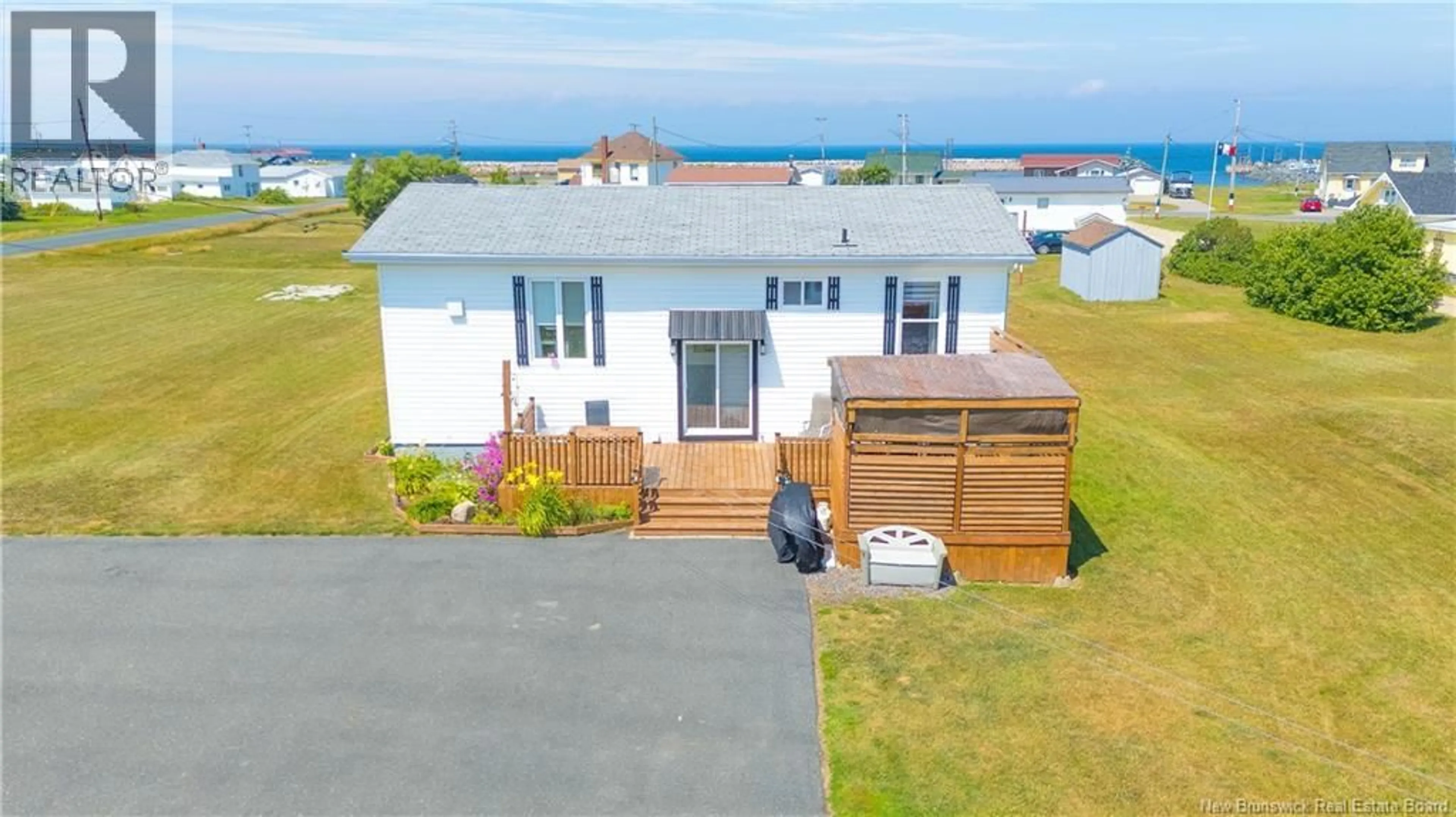 A pic from outside/outdoor area/front of a property/back of a property/a pic from drone, water/lake/river/ocean view for 25 DOWNING ROAD, Anse-Bleue New Brunswick E8N2E5