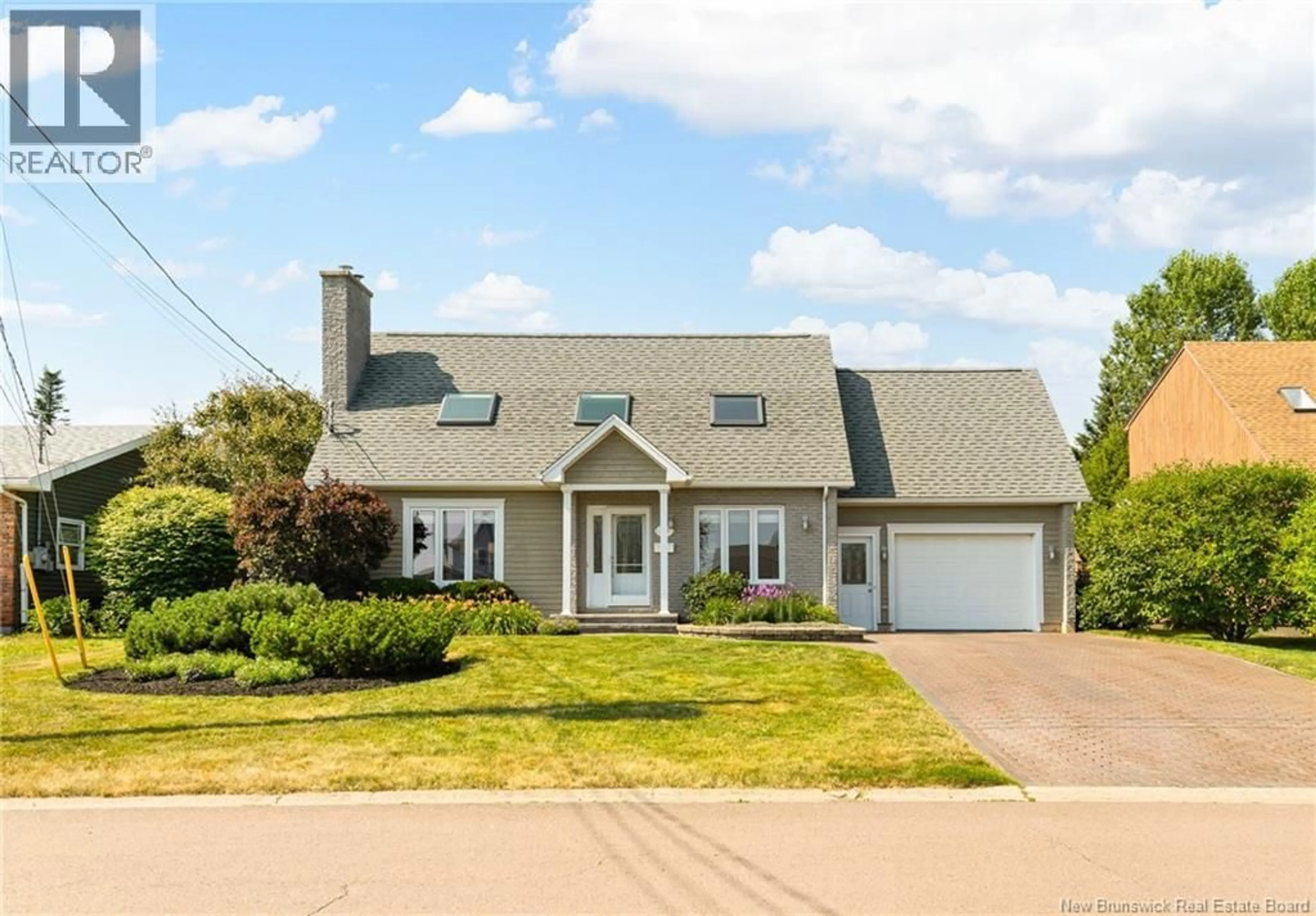 Home with vinyl exterior material, street for 305 JEAN DAROIS, Dieppe New Brunswick E1A6B2