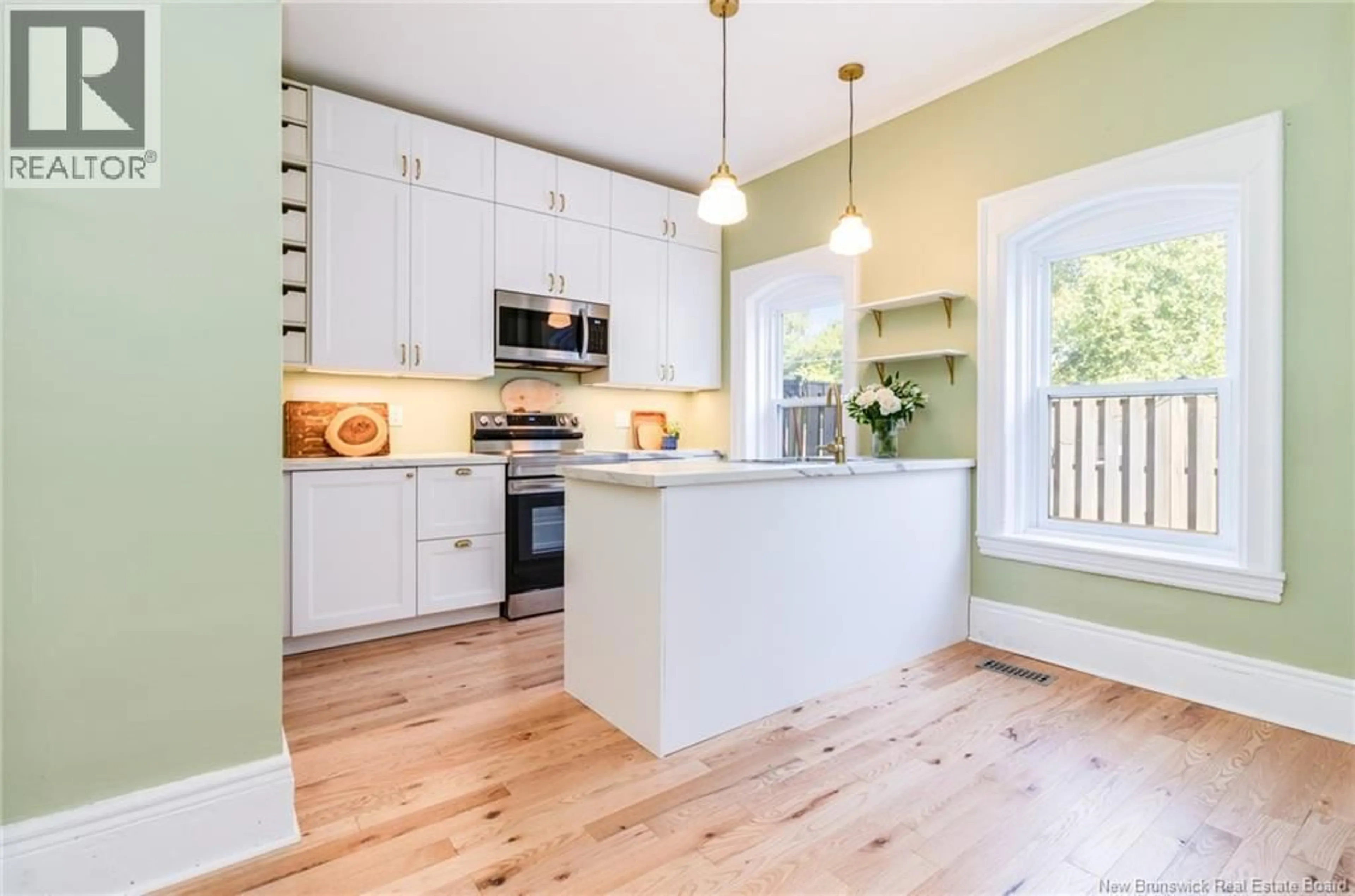 Open concept kitchen, wood/laminate floor for 17 BRIDGE STREET, Marysville New Brunswick E3A4L3