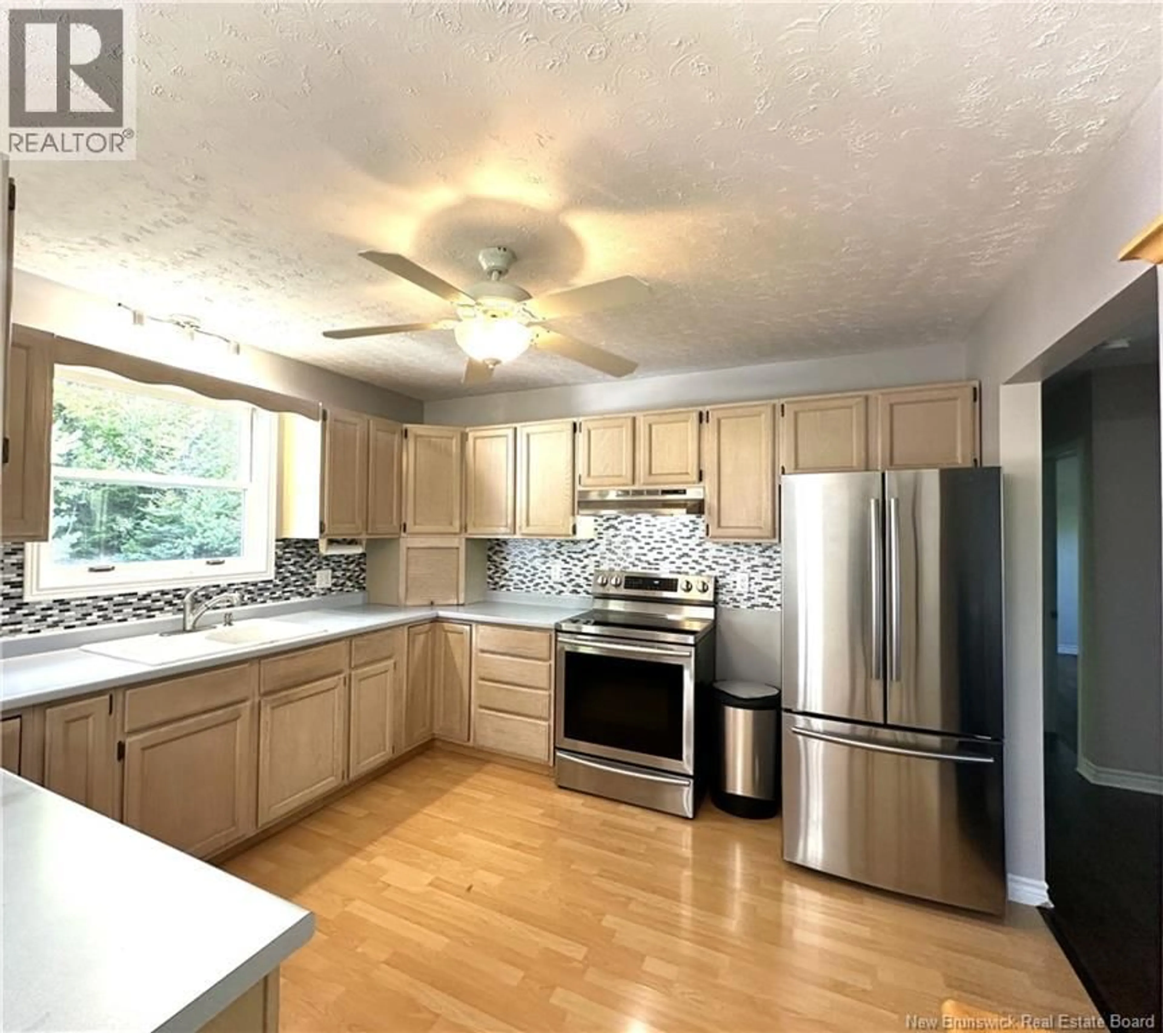Open concept kitchen, wood/laminate floor for 99 TOWER HILL ROAD, Tower Hill New Brunswick E5A2M5
