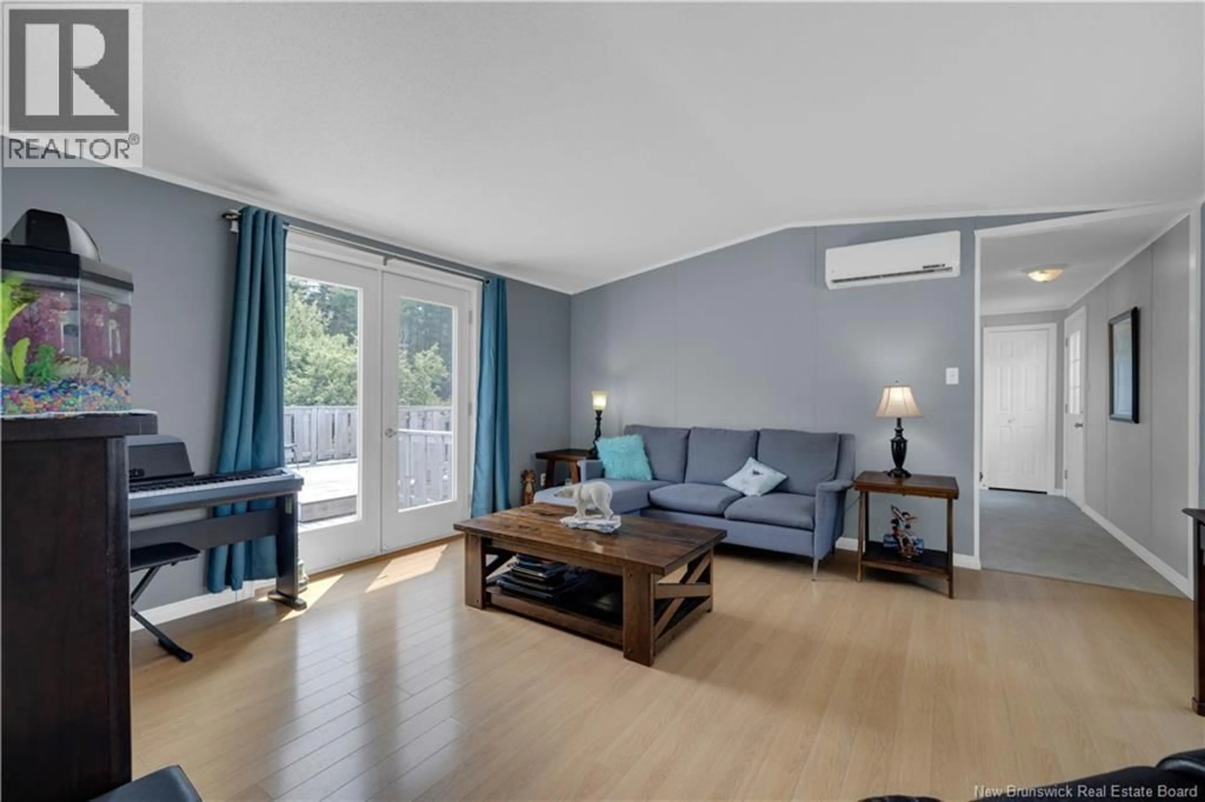 Living room with furniture, wood/laminate floor for 64 TAYLOR LAKE ROAD, Willow Grove New Brunswick E2S1R1