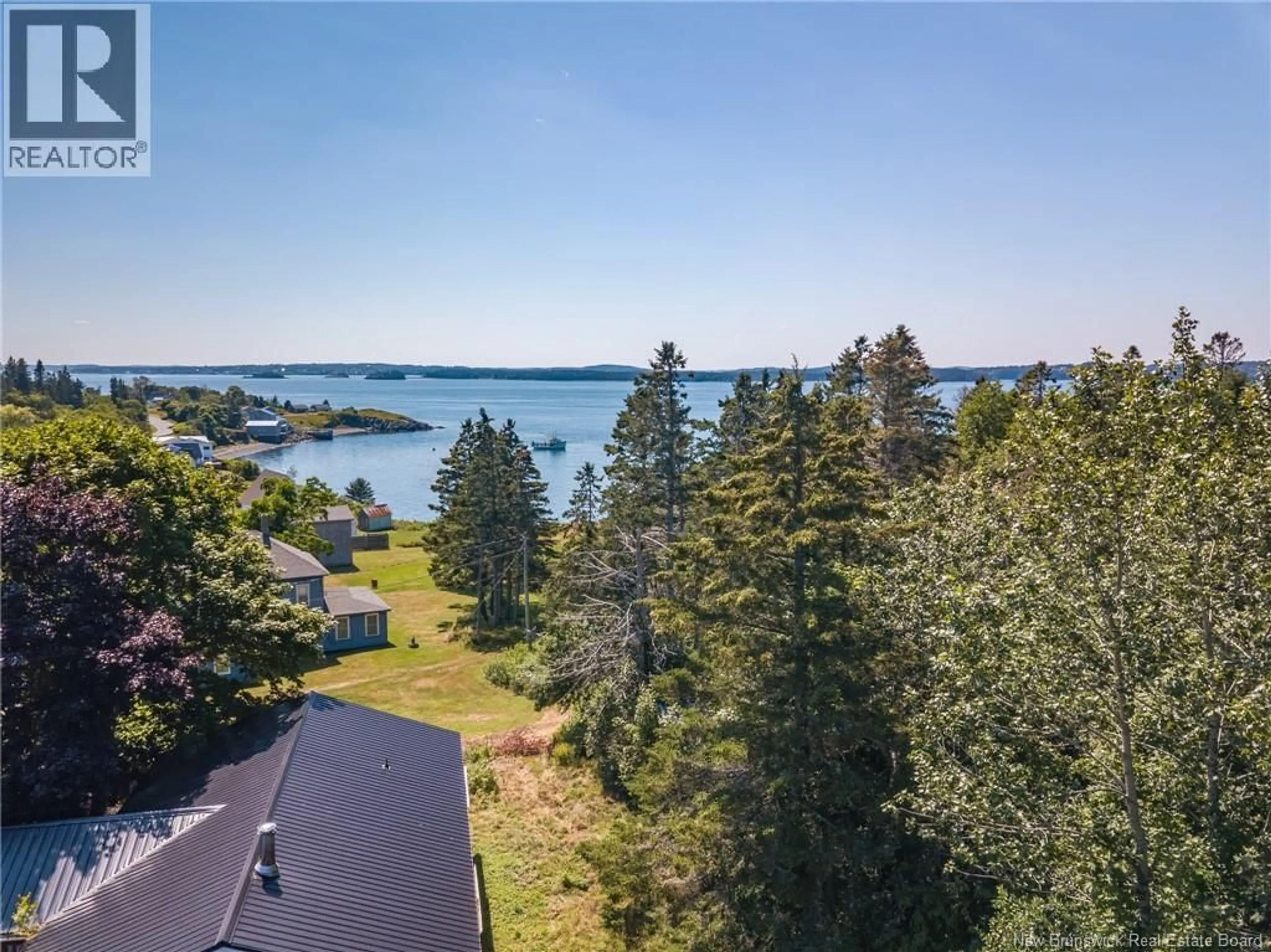 A pic from outside/outdoor area/front of a property/back of a property/a pic from drone, water/lake/river/ocean view for 2561 ROUTE 774, Wilsons Beach New Brunswick E5E1J8