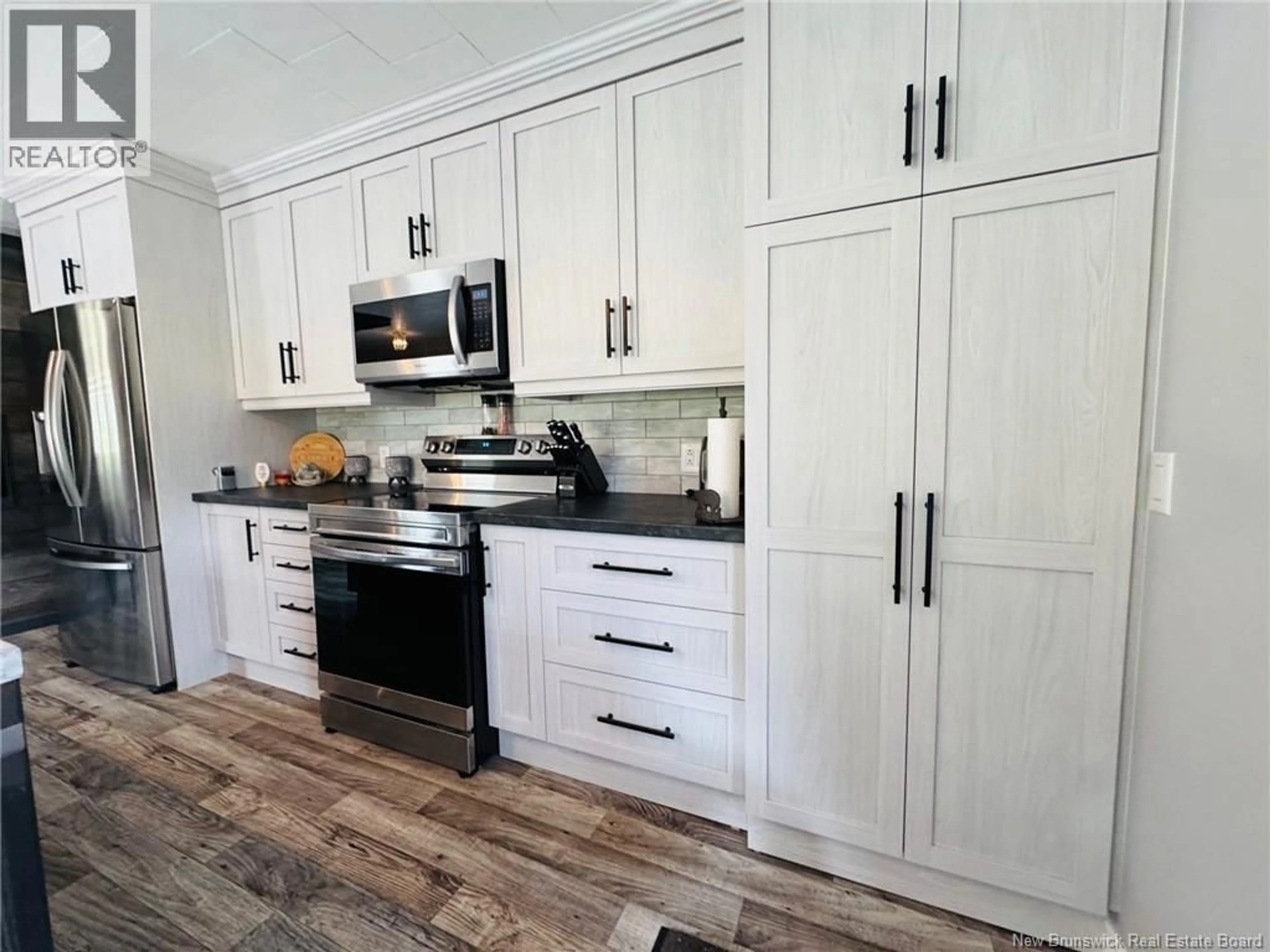 Open concept kitchen, wood/laminate floor for 762 ST-MAURE ROAD, Saint-Maure New Brunswick E8E1N3