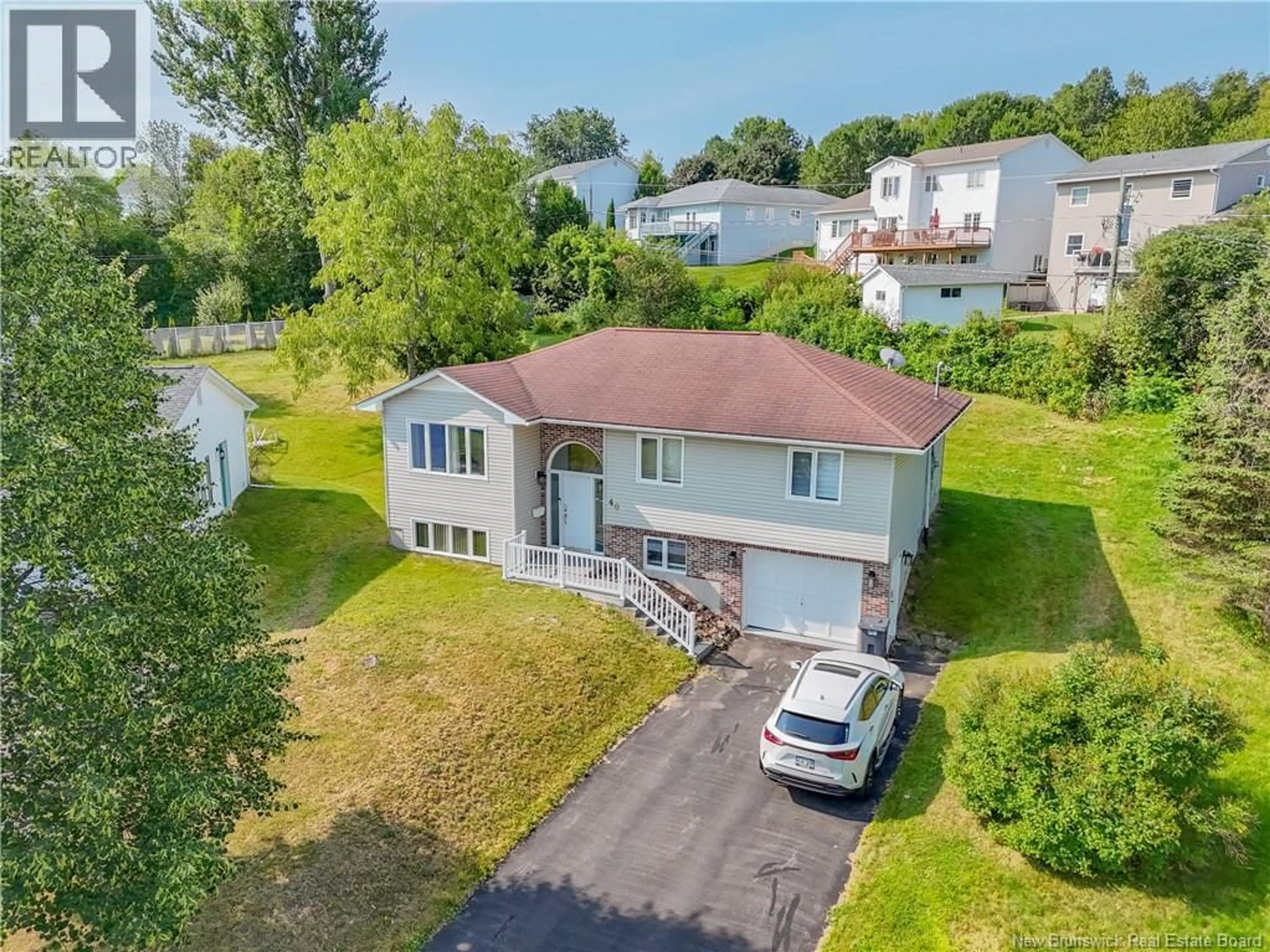 A pic from outside/outdoor area/front of a property/back of a property/a pic from drone, street for 40 CARTER COURT, Fredericton New Brunswick E3B6Y1