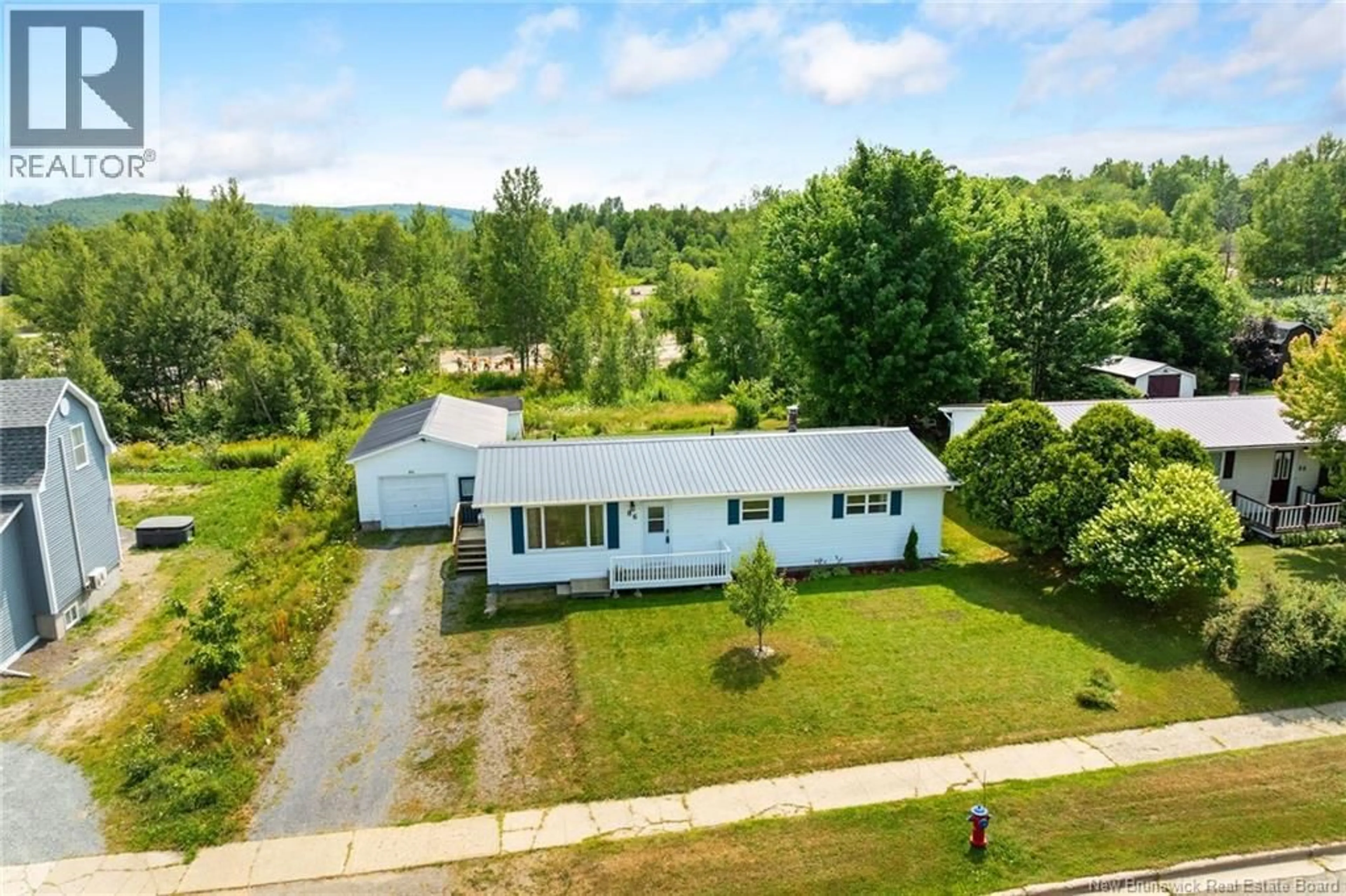 A pic from outside/outdoor area/front of a property/back of a property/a pic from drone, unknown for 86 LANDEGGER DRIVE, Nackawic New Brunswick E3G1G2