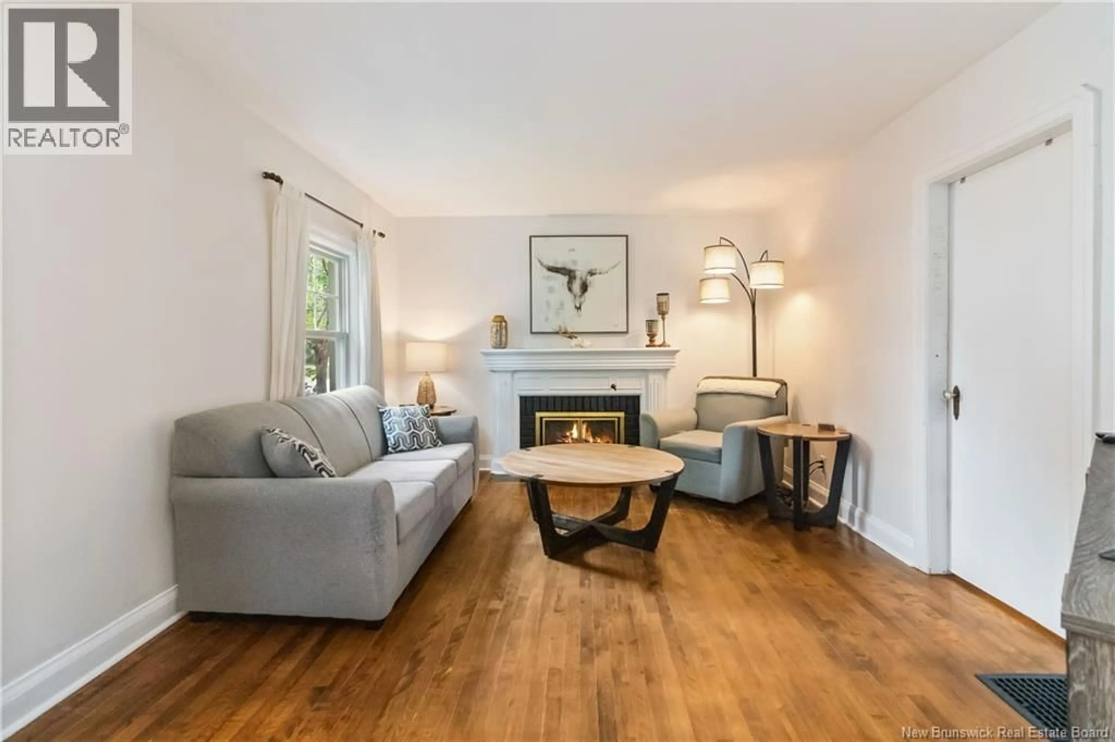 Living room with furniture, wood/laminate floor for 143 BROMLEY AVENUE, Moncton New Brunswick E1C5V3