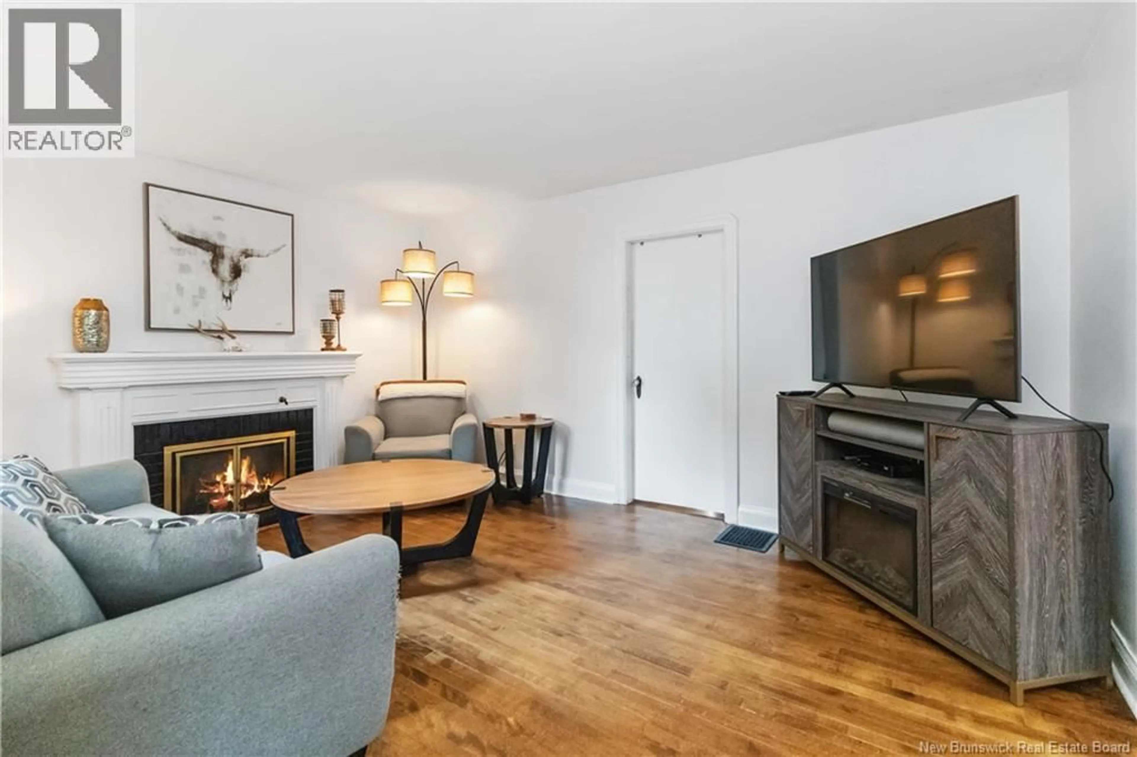 Living room with furniture, wood/laminate floor for 143 BROMLEY AVENUE, Moncton New Brunswick E1C5V3