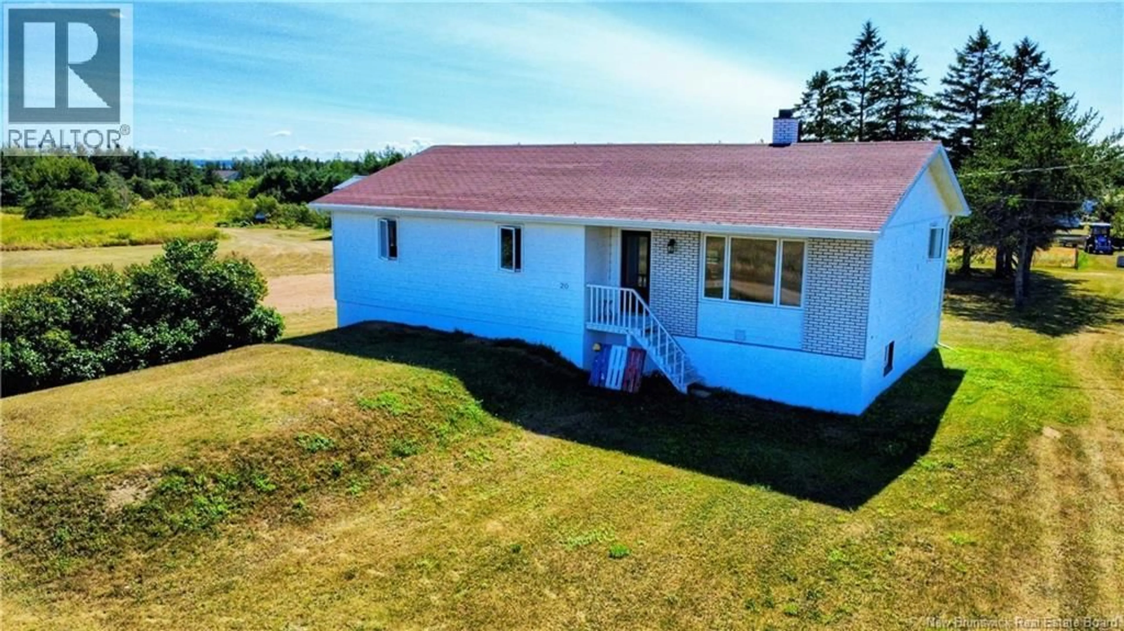 A pic from outside/outdoor area/front of a property/back of a property/a pic from drone, building for 20 CHEM. JEAN PIERRE, Maisonnette New Brunswick E8N1Z8
