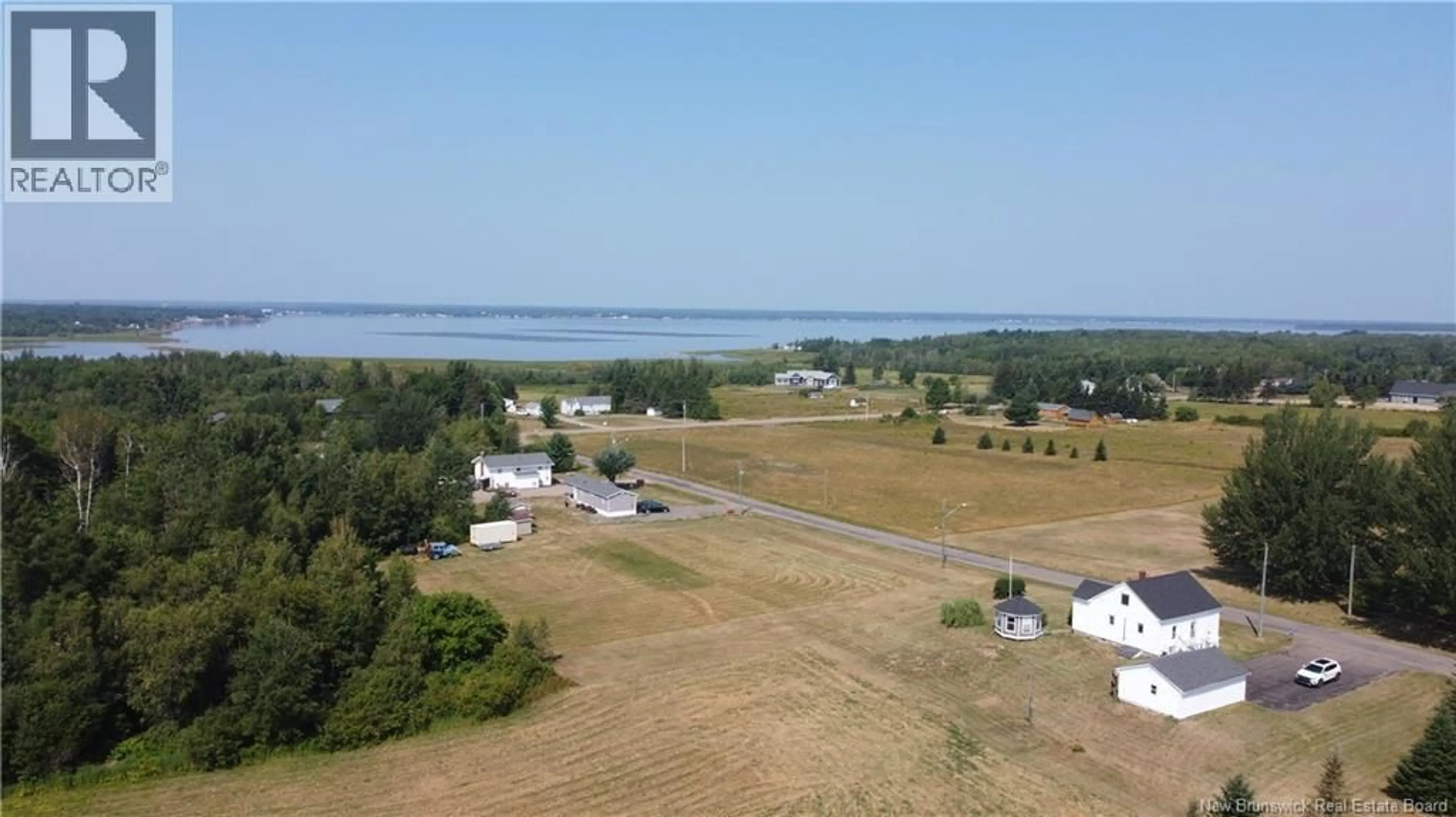A pic from outside/outdoor area/front of a property/back of a property/a pic from drone, water/lake/river/ocean view for 42 MARTIAL HEBERT ROAD, Grande-Digue New Brunswick E4R4V2