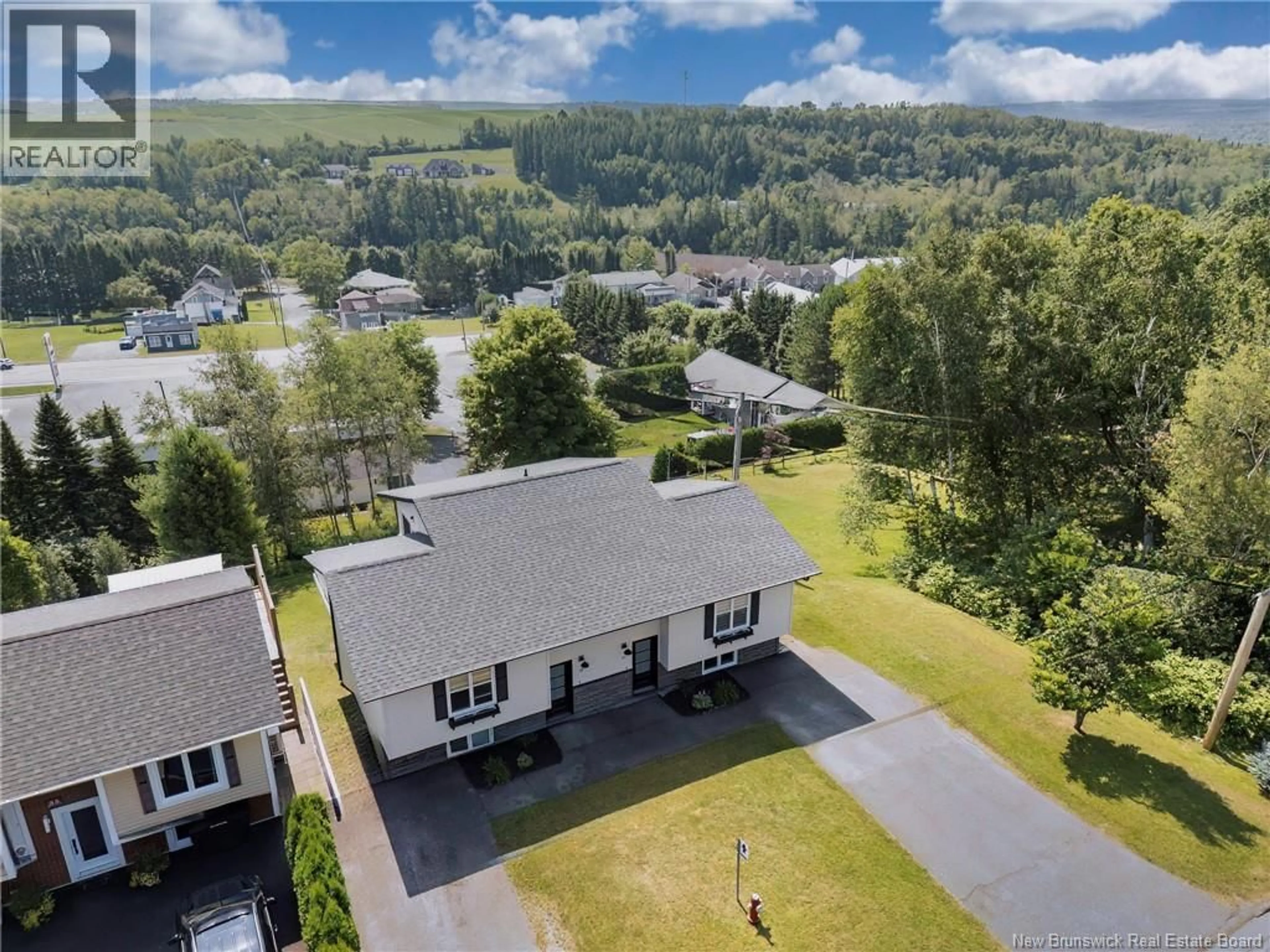 A pic from outside/outdoor area/front of a property/back of a property/a pic from drone, mountain view for 39-41 BELAIR STREET, Grand Falls New Brunswick E3Y1A8