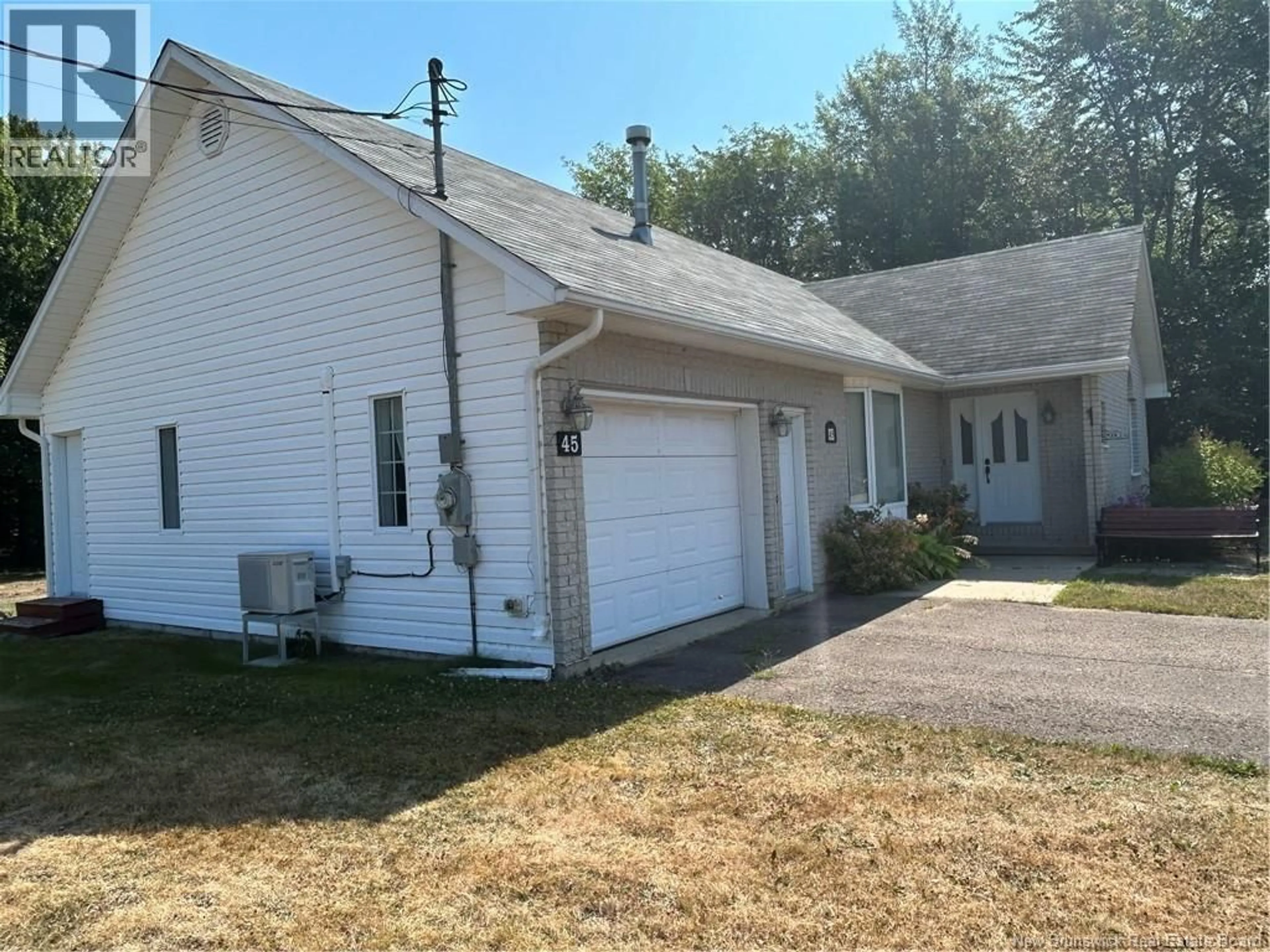 Home with vinyl exterior material, street for 45 RUE EDDY, Neguac New Brunswick E9G1C9