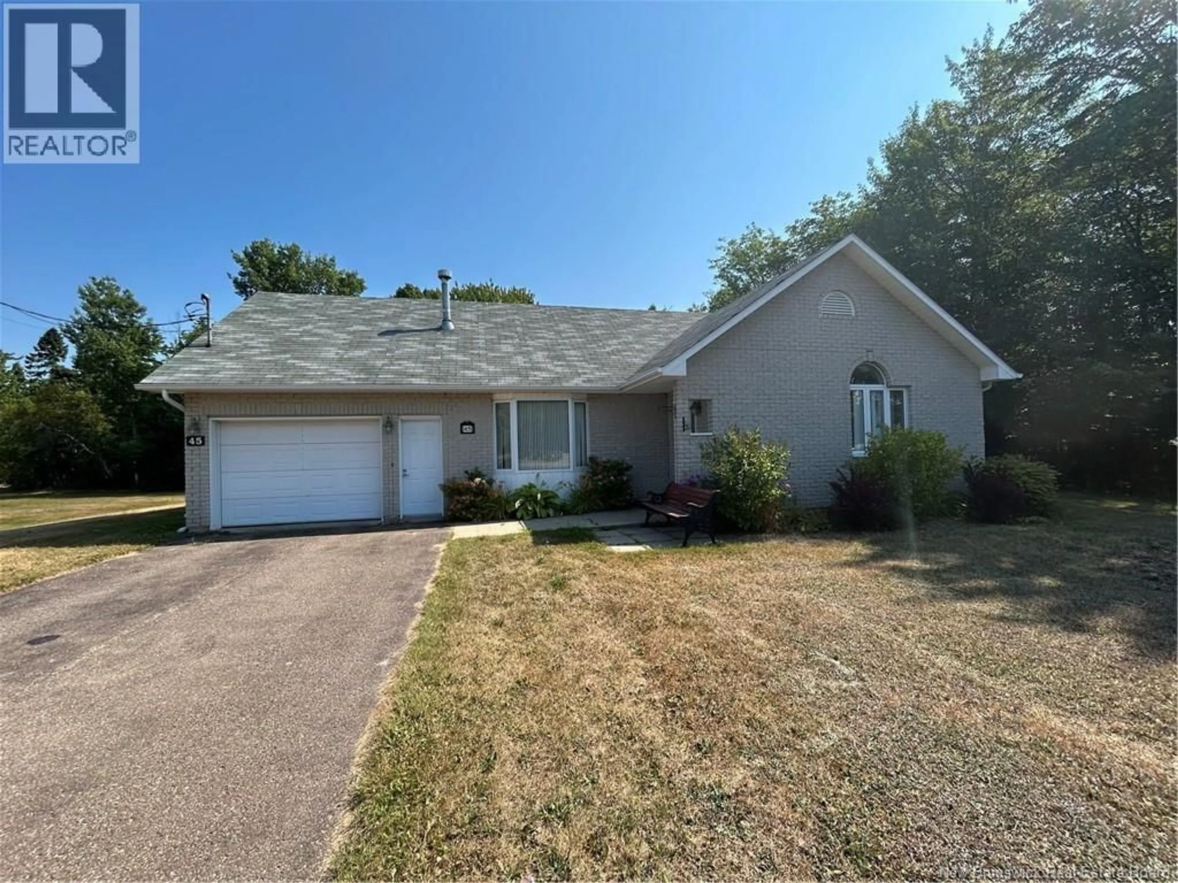 Home with vinyl exterior material, street for 45 RUE EDDY, Neguac New Brunswick E9G1C9