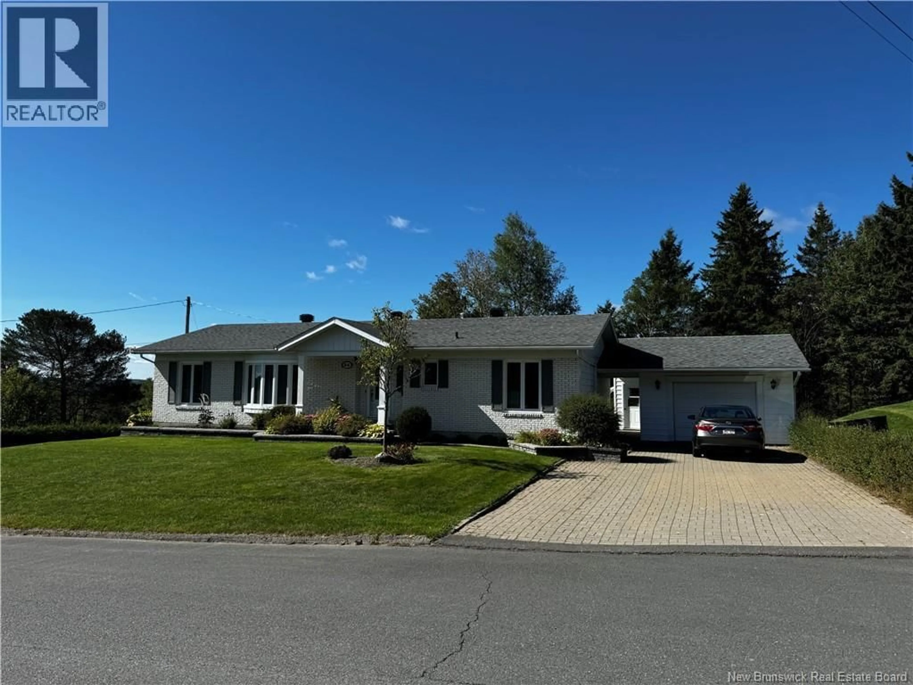 Home with vinyl exterior material, street for 84 PHILIPPE AVENUE, Edmundston New Brunswick E3V1R1