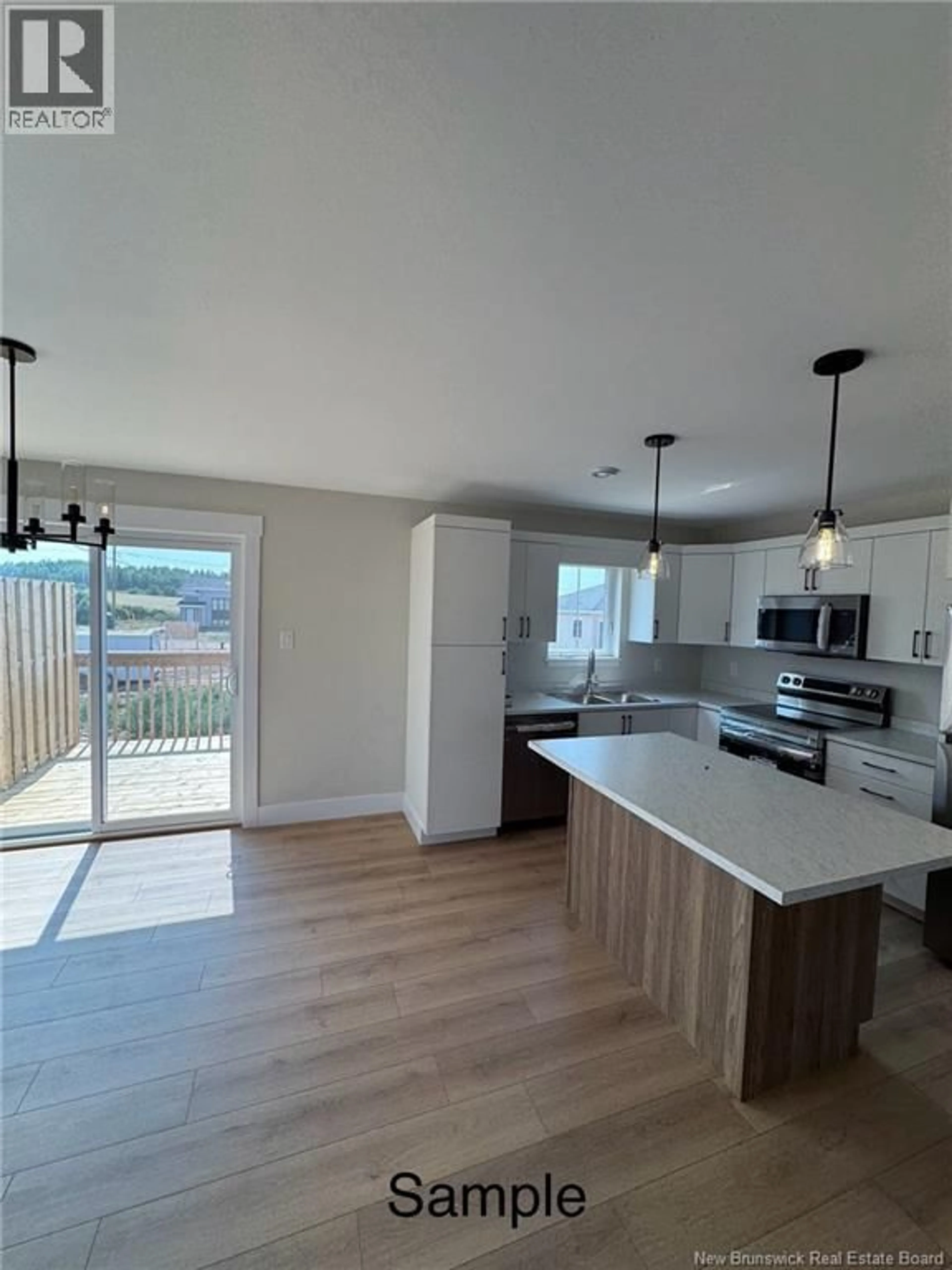 Open concept kitchen, wood/laminate floor for 13 ALOSIER CRESCENT, Moncton New Brunswick E1K0A1