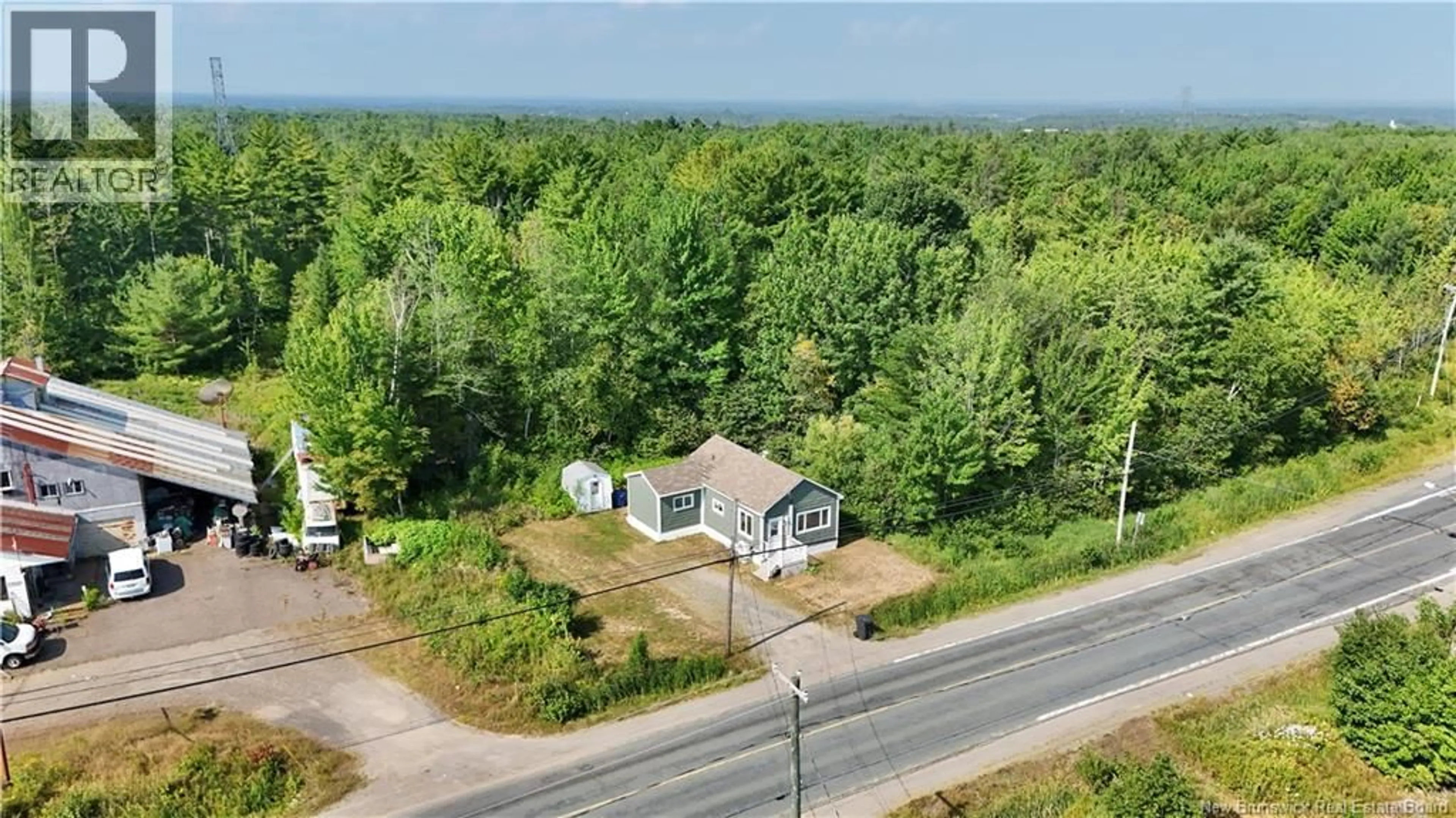 A pic from outside/outdoor area/front of a property/back of a property/a pic from drone, unknown for 2290 MIRAMICHI AVENUE, Bathurst New Brunswick E2A6H6