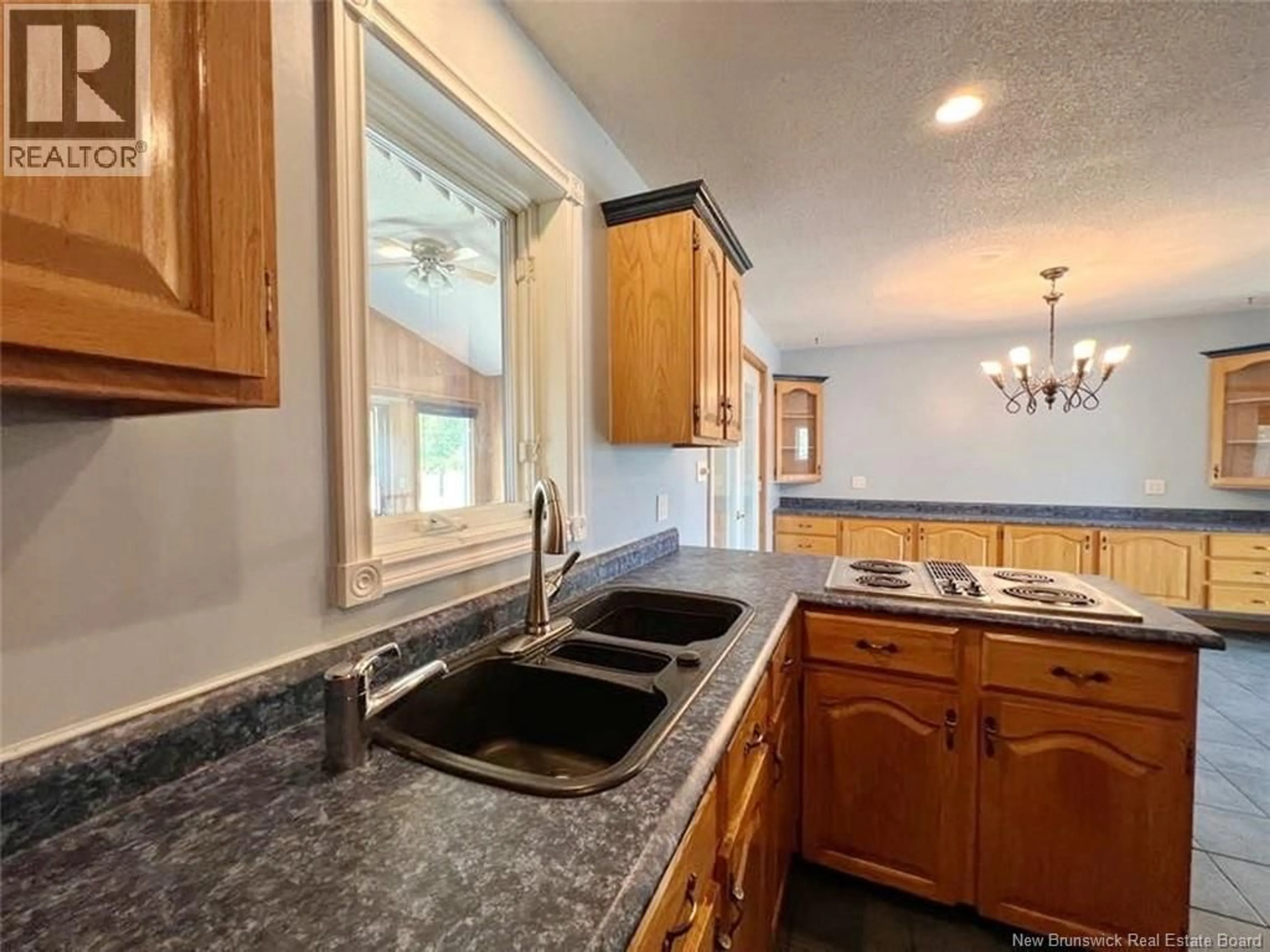 Open concept kitchen, ceramic/tile floor for 1169 ST-FRANCOIS STREET, Edmundston New Brunswick E3V4P5