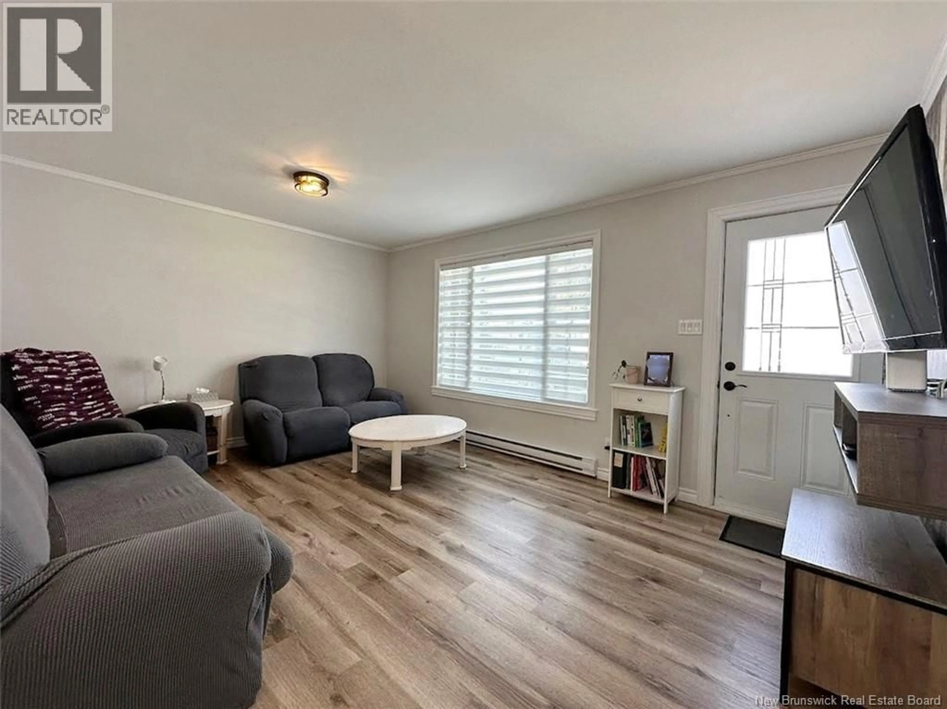 Living room with furniture, wood/laminate floor for 25 DES SOEURS STREET, Saint-Jacques New Brunswick E7B1G5