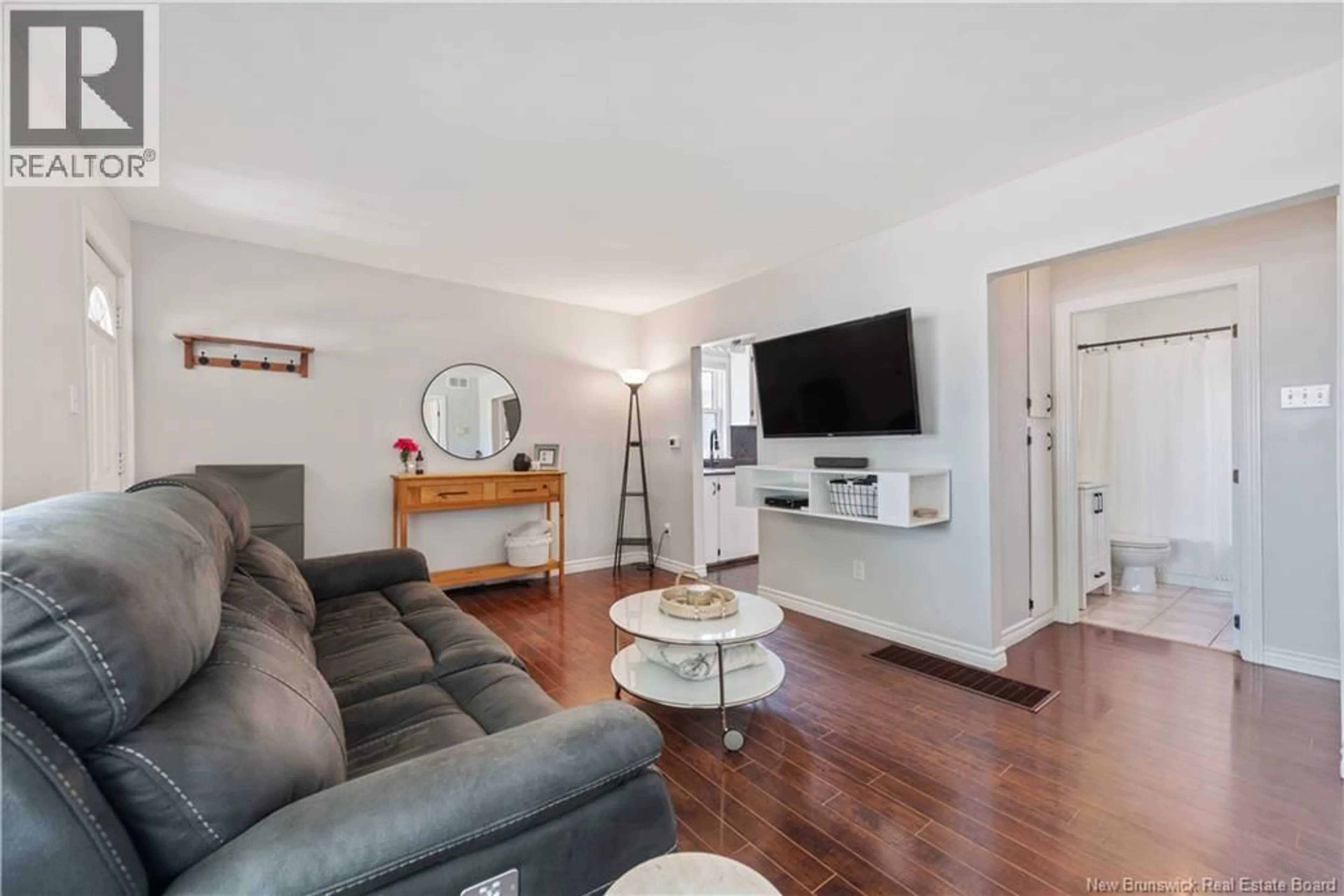Living room with furniture, wood/laminate floor for 160 JONES STREET, Moncton New Brunswick E1C6J6
